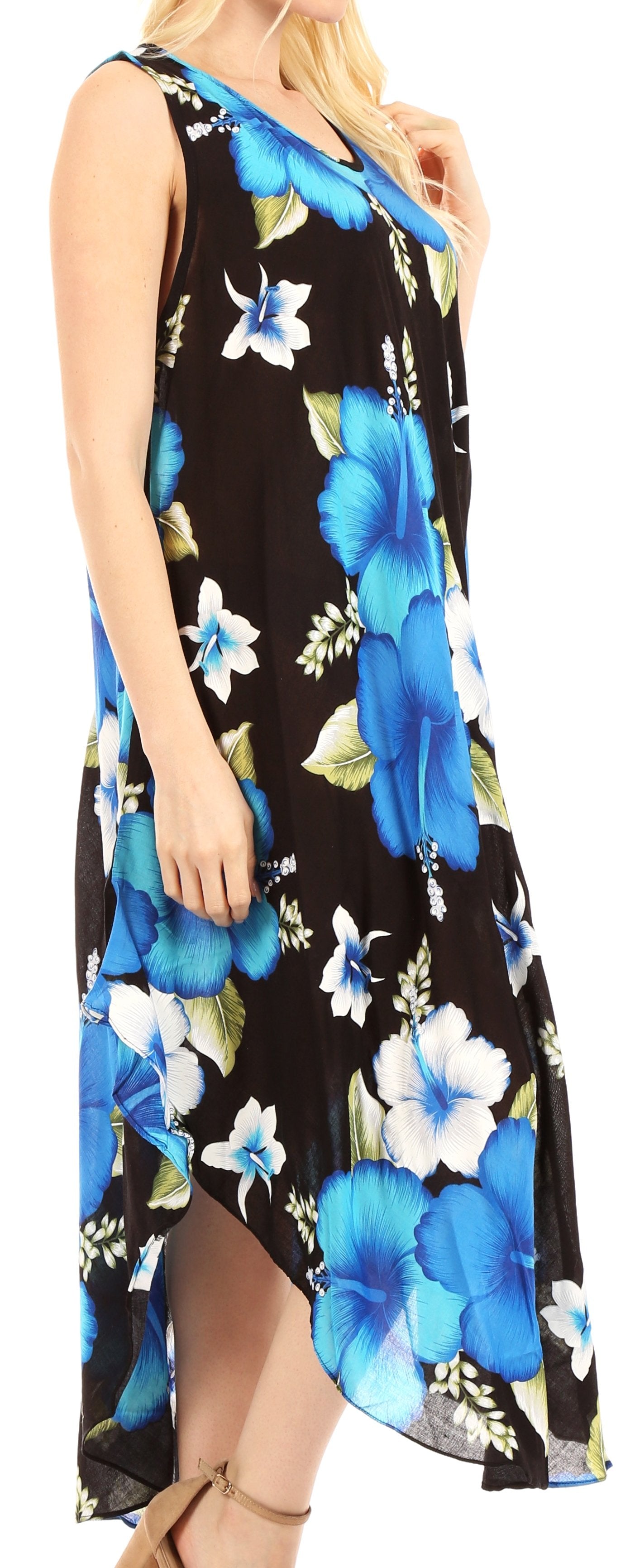 Woman wearing a sleeveless dress with blue floral pattern on a black background