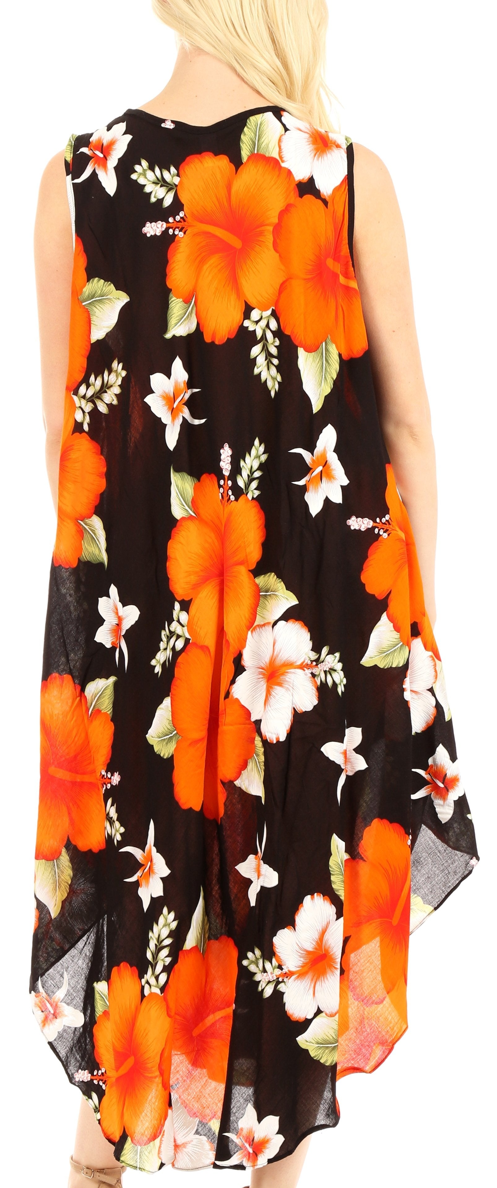 Woman wearing a sleeveless dress with orange and white floral pattern on black background