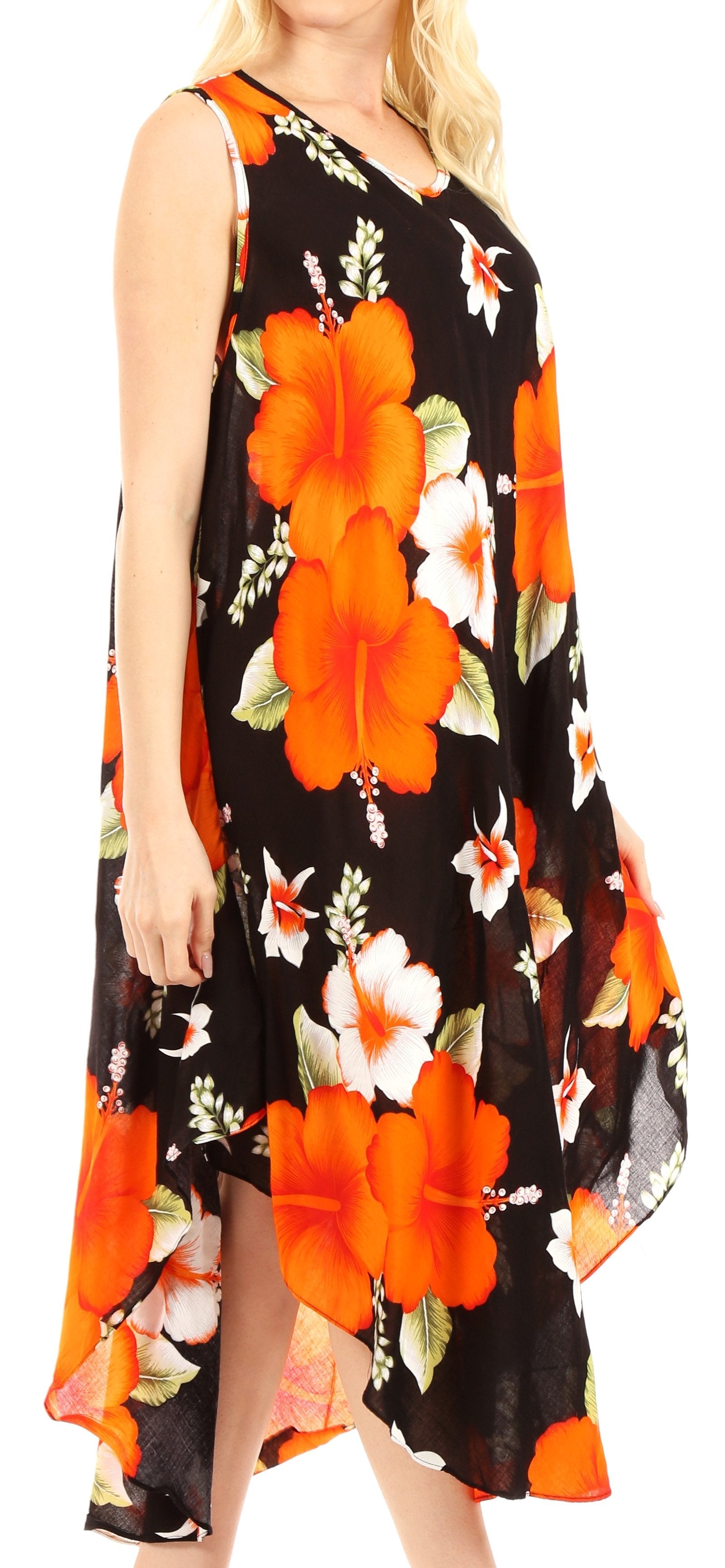 Woman wearing a black dress with orange and white floral patterns