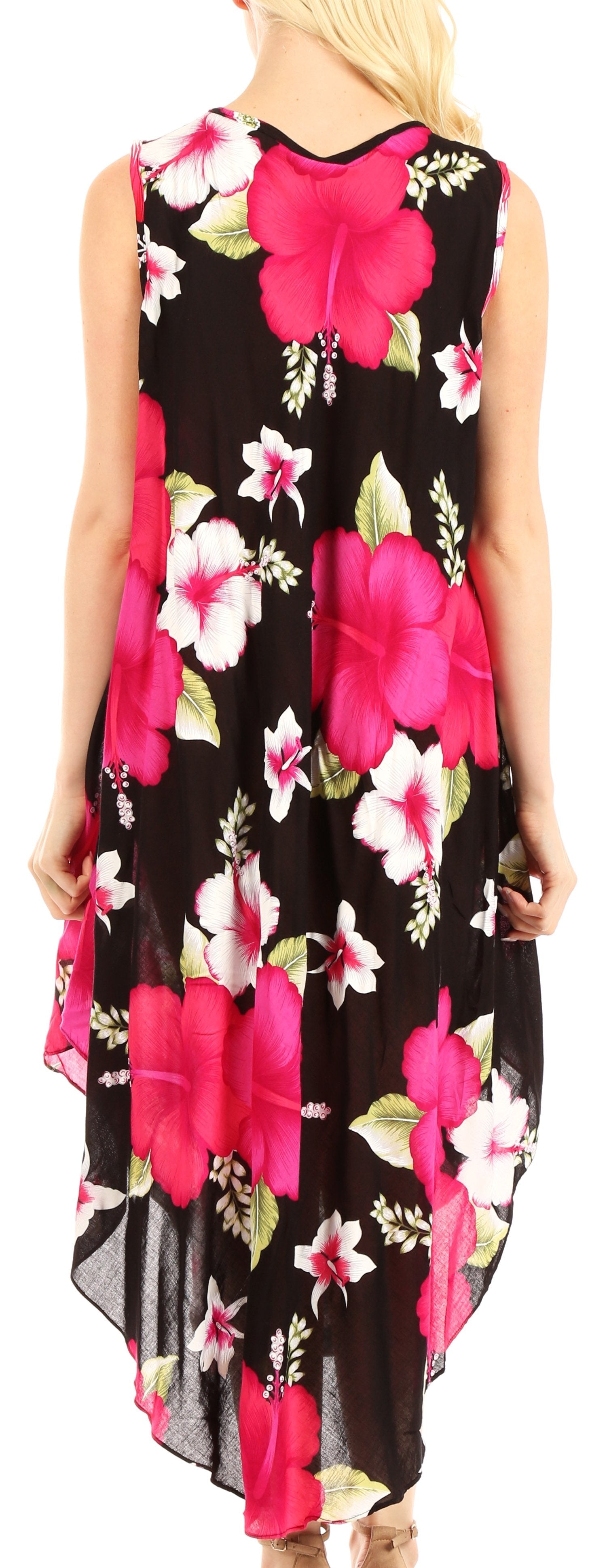 Woman wearing a sleeveless dress with pink floral pattern on a black background