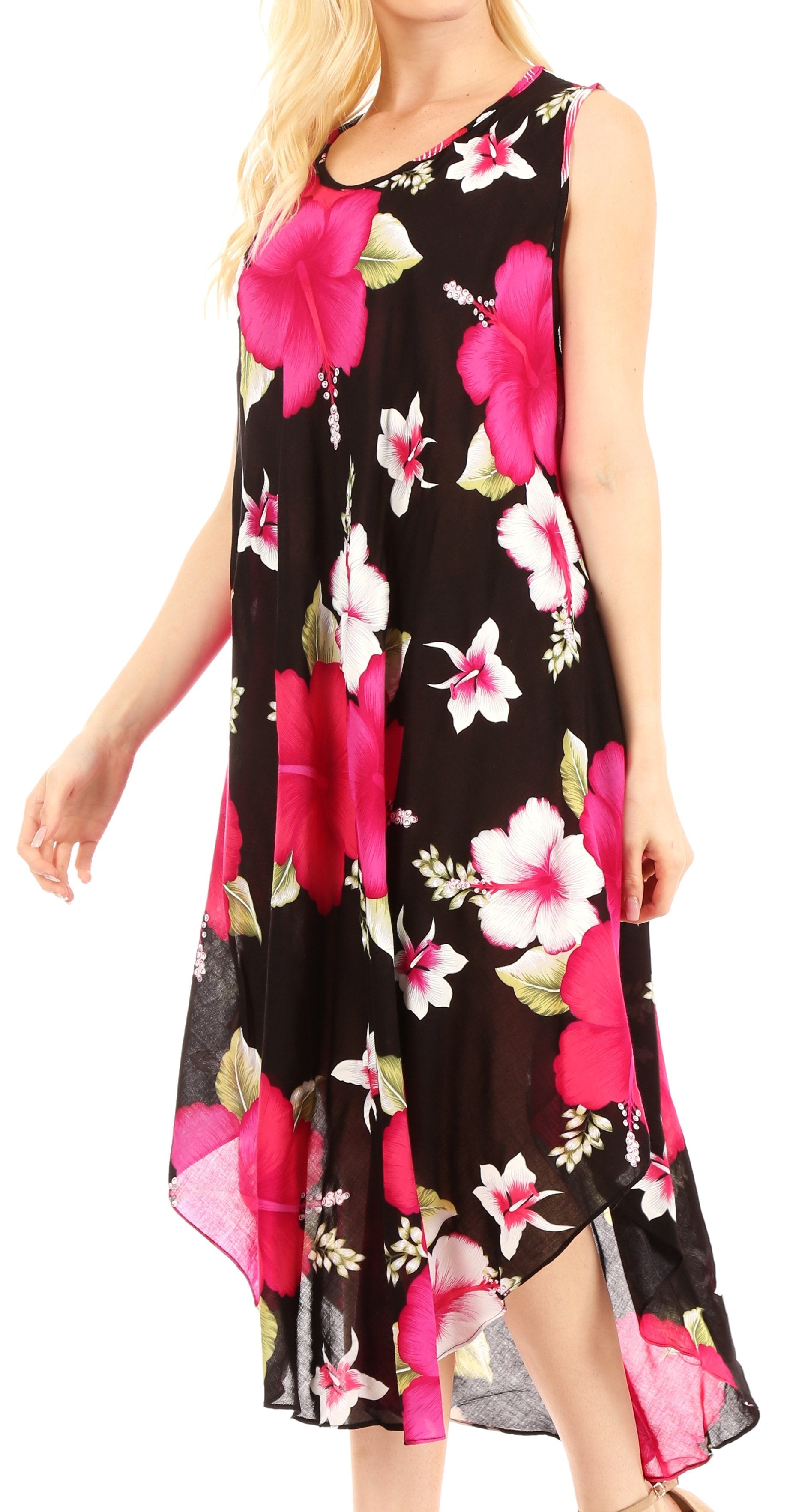 Woman wearing a sleeveless floral dress with pink and white flowers on a black background.