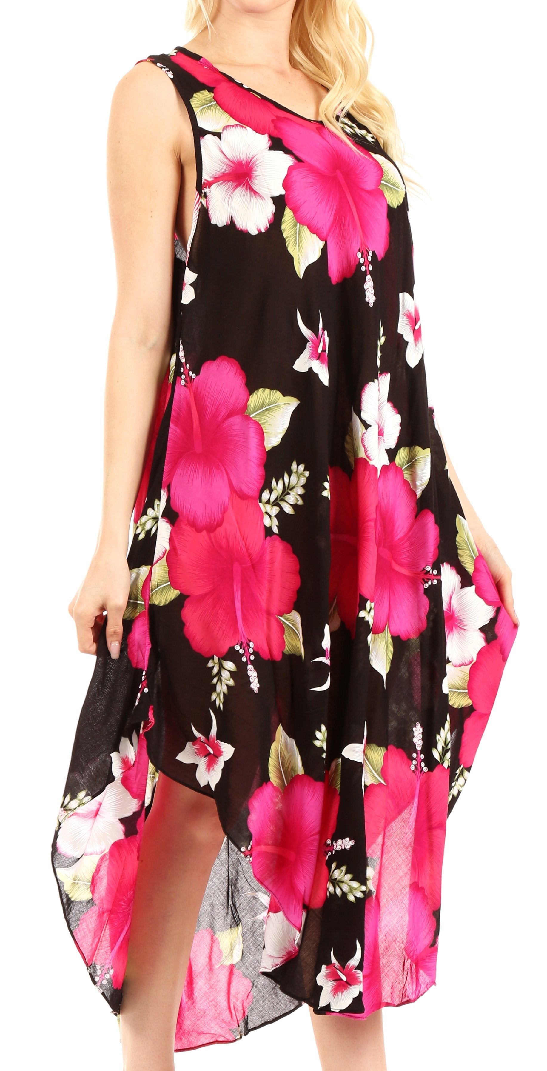 Woman wearing a floral dress with pink flowers on a black background