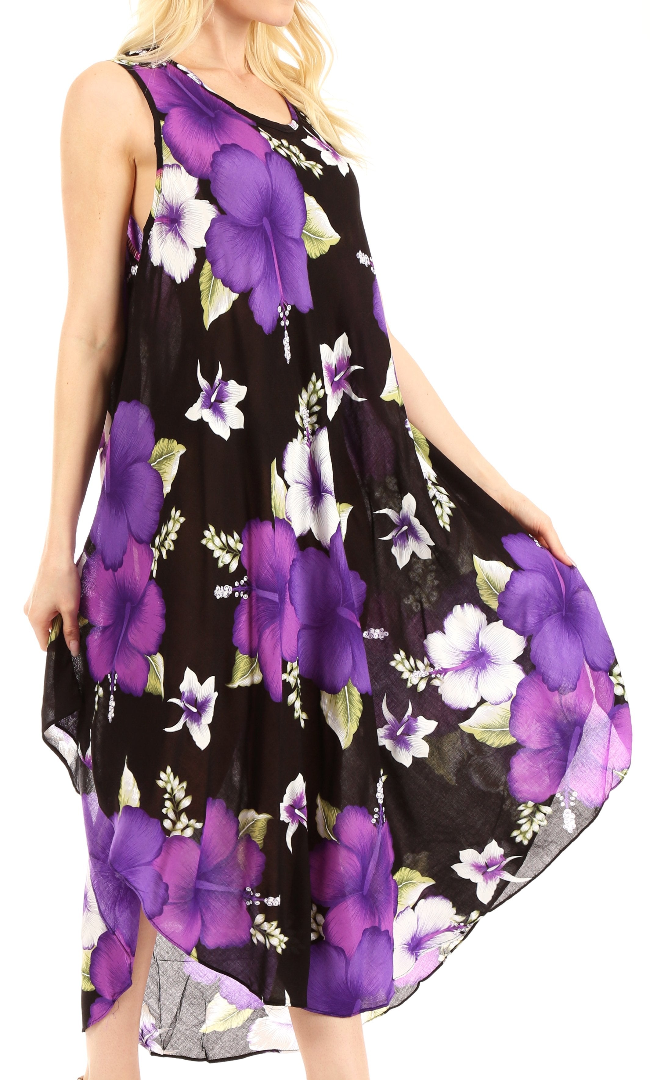 Woman wearing a black dress with purple floral pattern on a white background