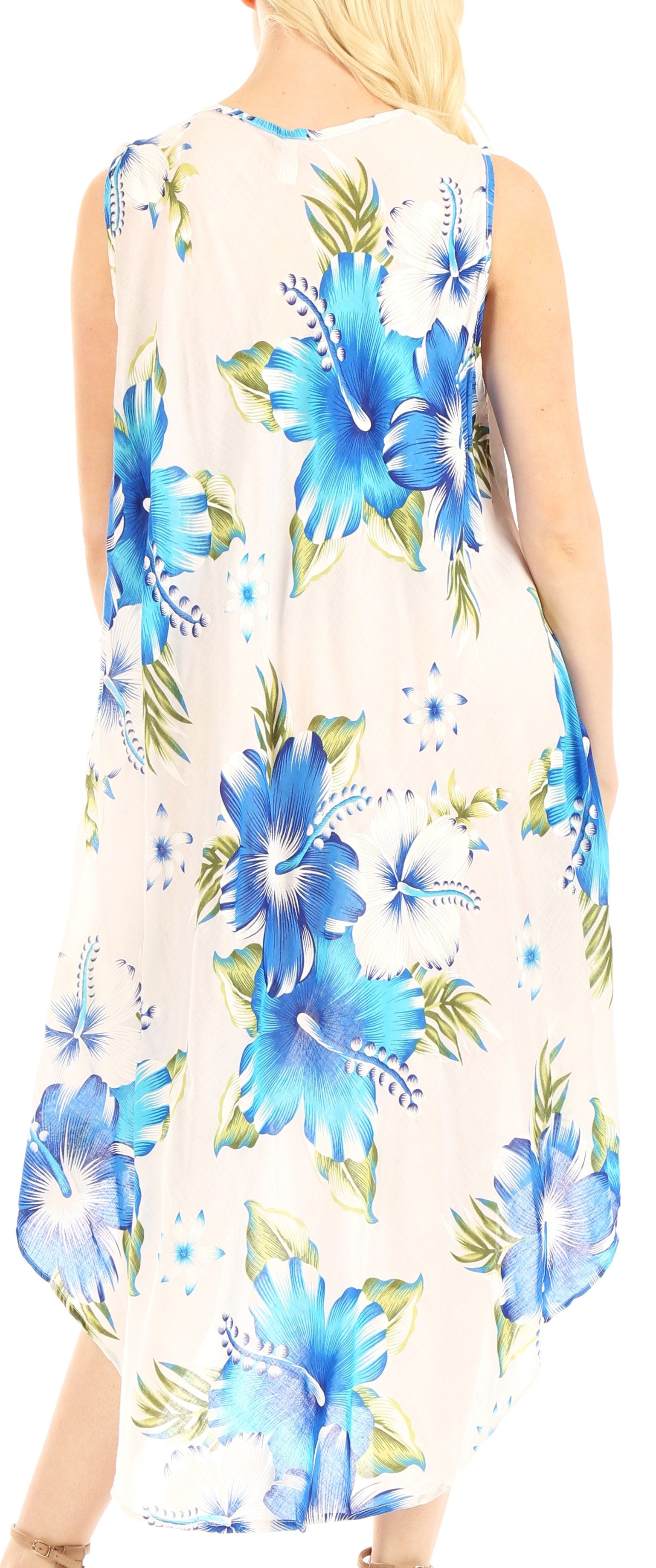 Woman wearing a sleeveless dress with blue floral pattern on a white background
