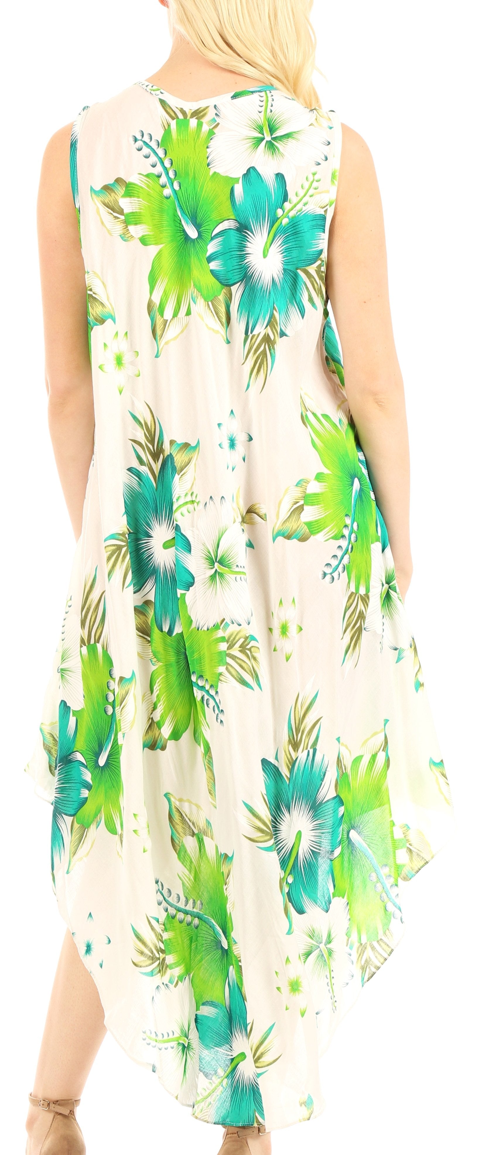 Woman wearing a sleeveless dress with green floral pattern on a white background