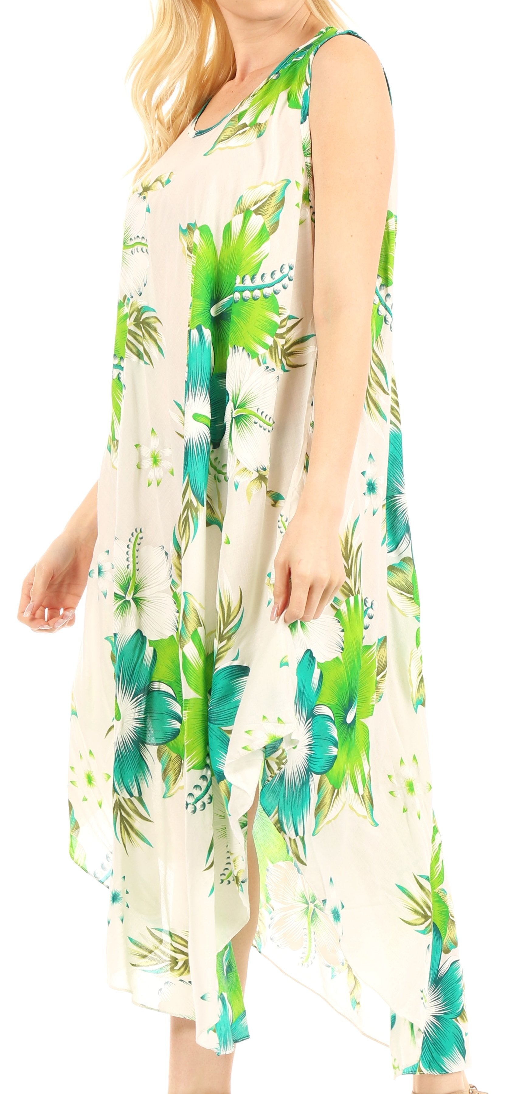 Woman wearing a floral dress with green and blue patterns on a white background