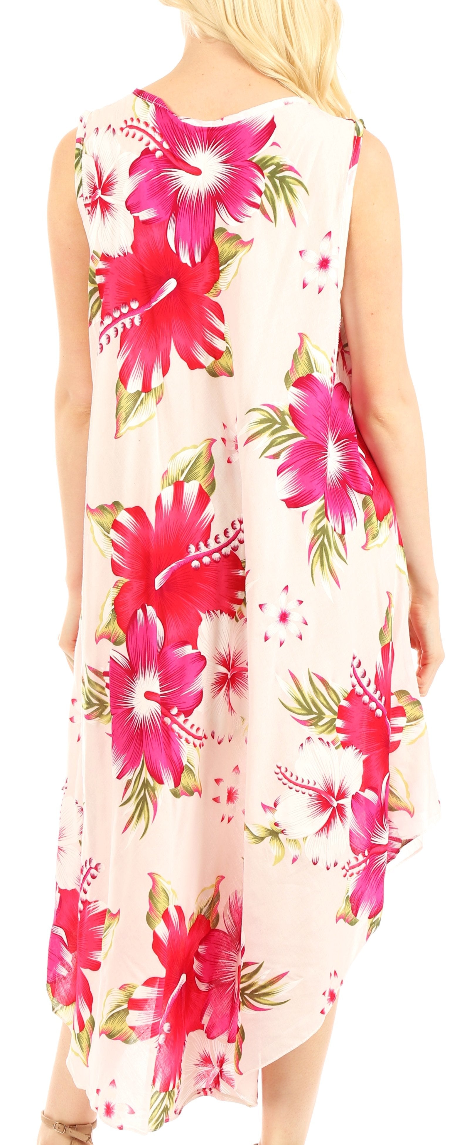 Woman wearing a sleeveless floral dress with pink flowers on a white background
