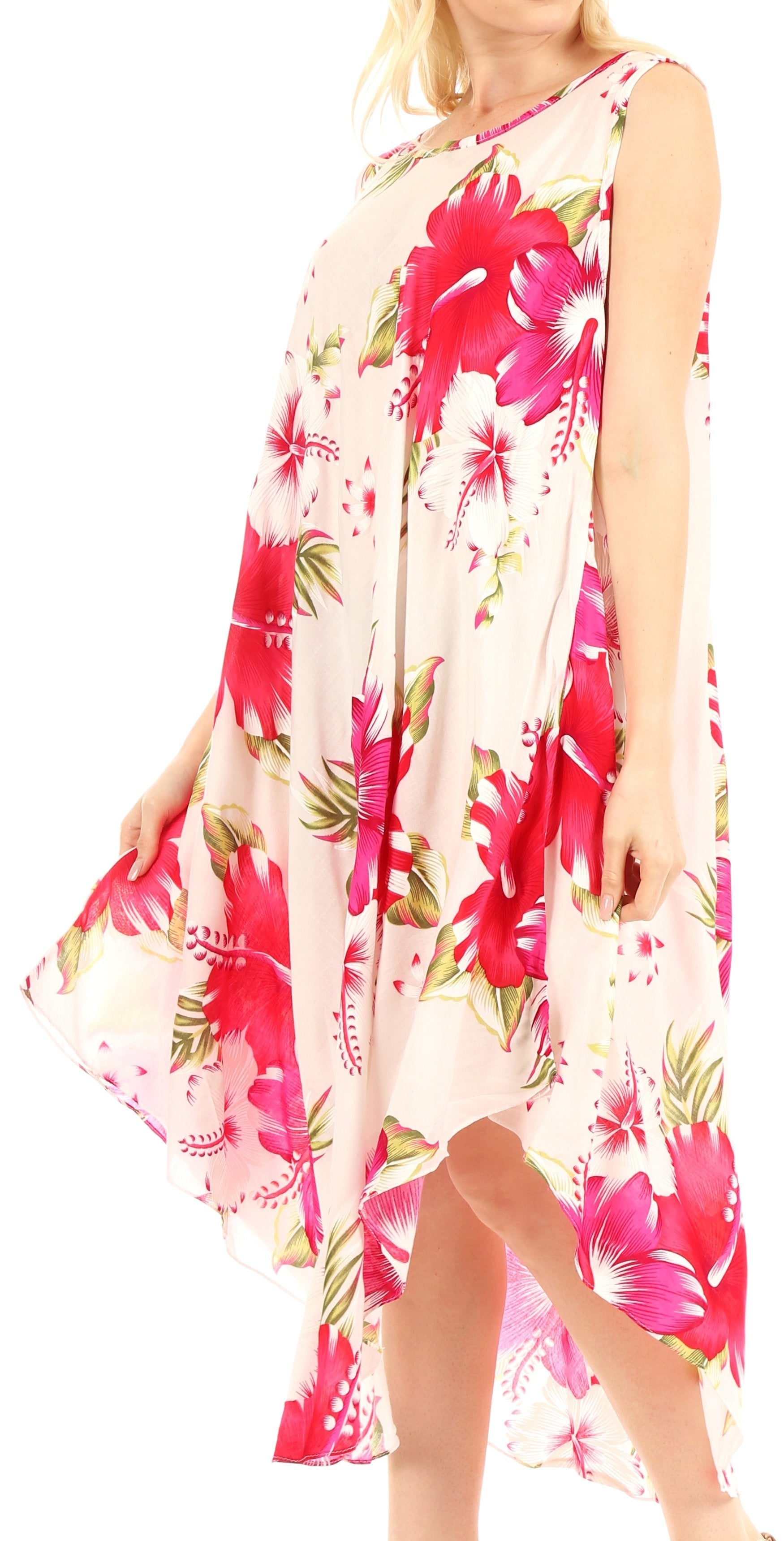 Woman wearing a floral dress with pink and green flowers on a white background