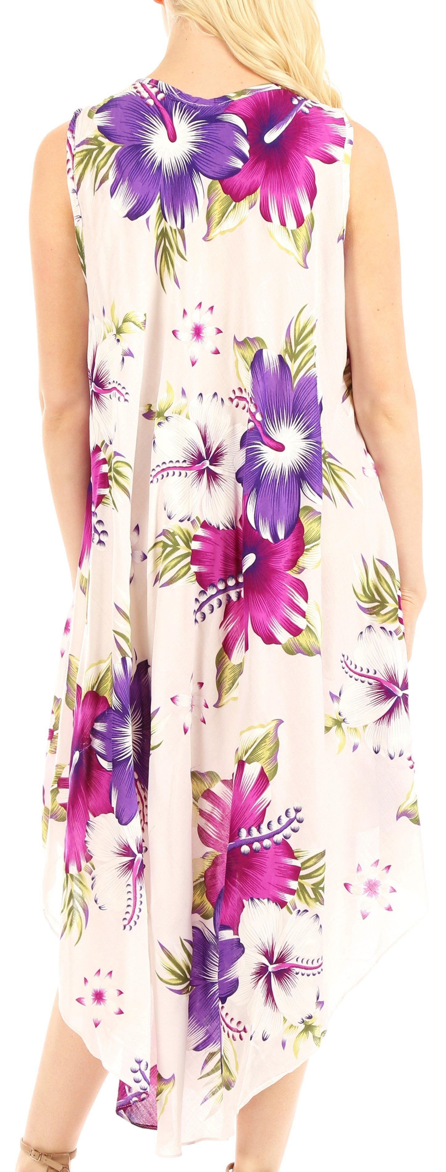 Woman wearing a sleeveless floral dress with purple and pink flowers on a white background