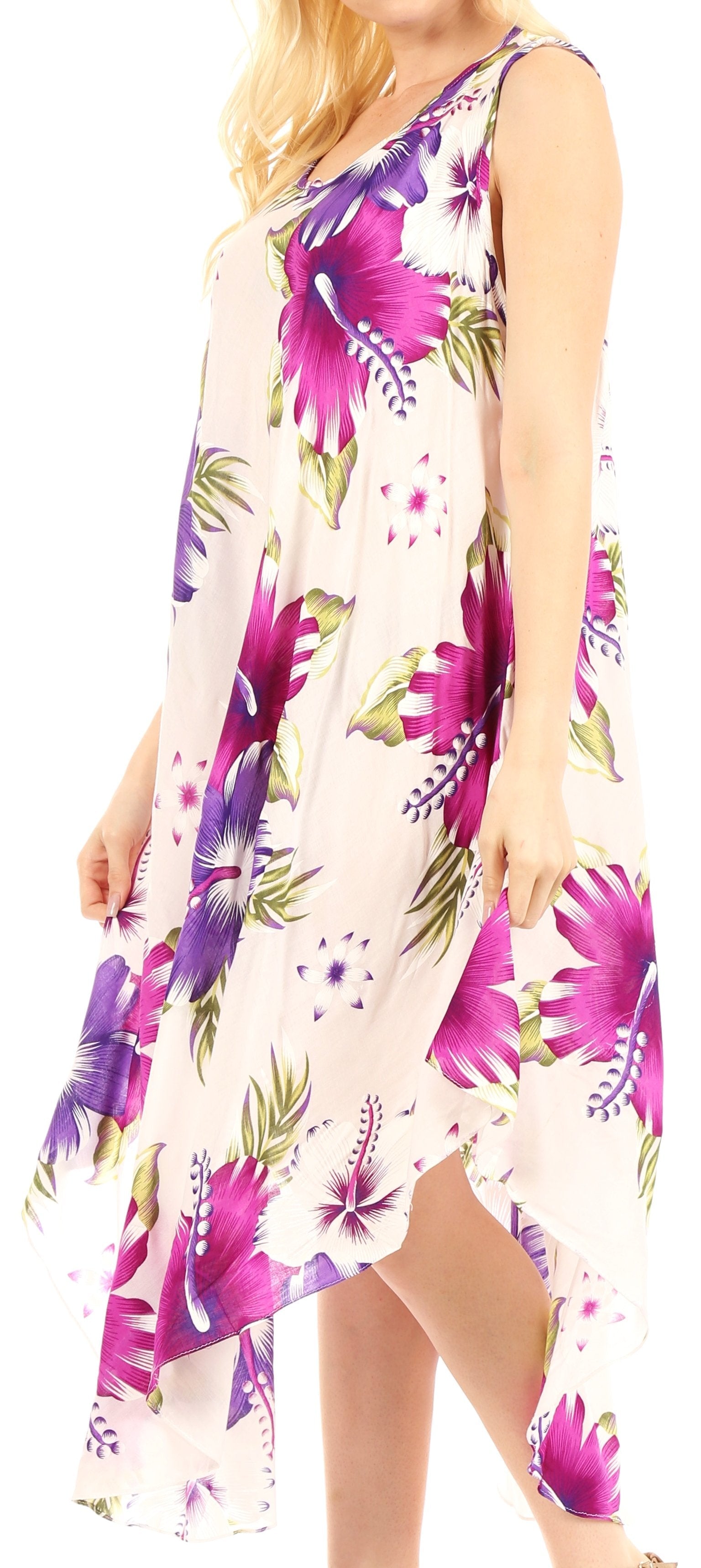 Woman wearing a floral dress with purple and green flowers on a white background
