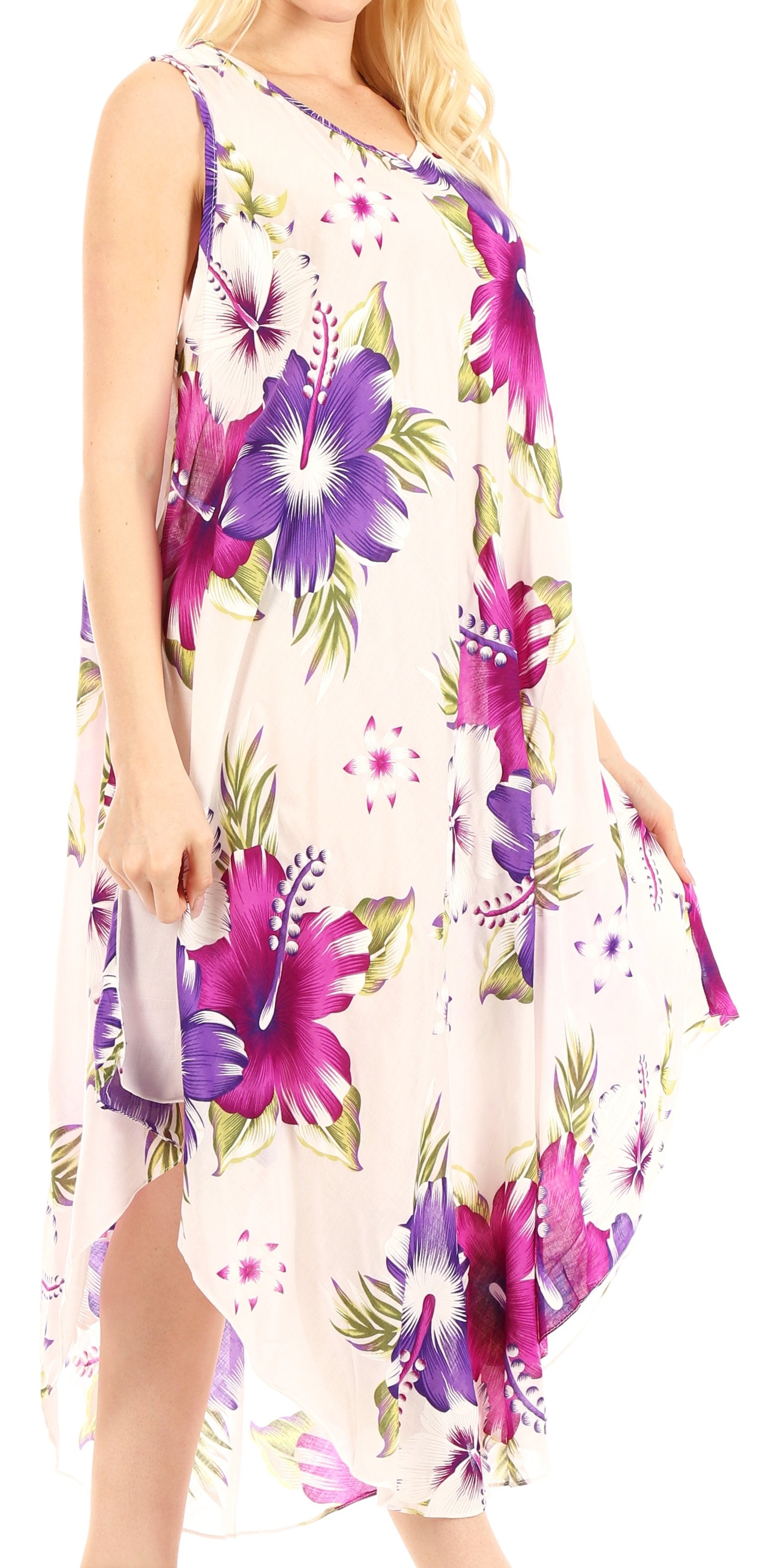 Woman wearing a floral dress with purple and pink flowers on a white background