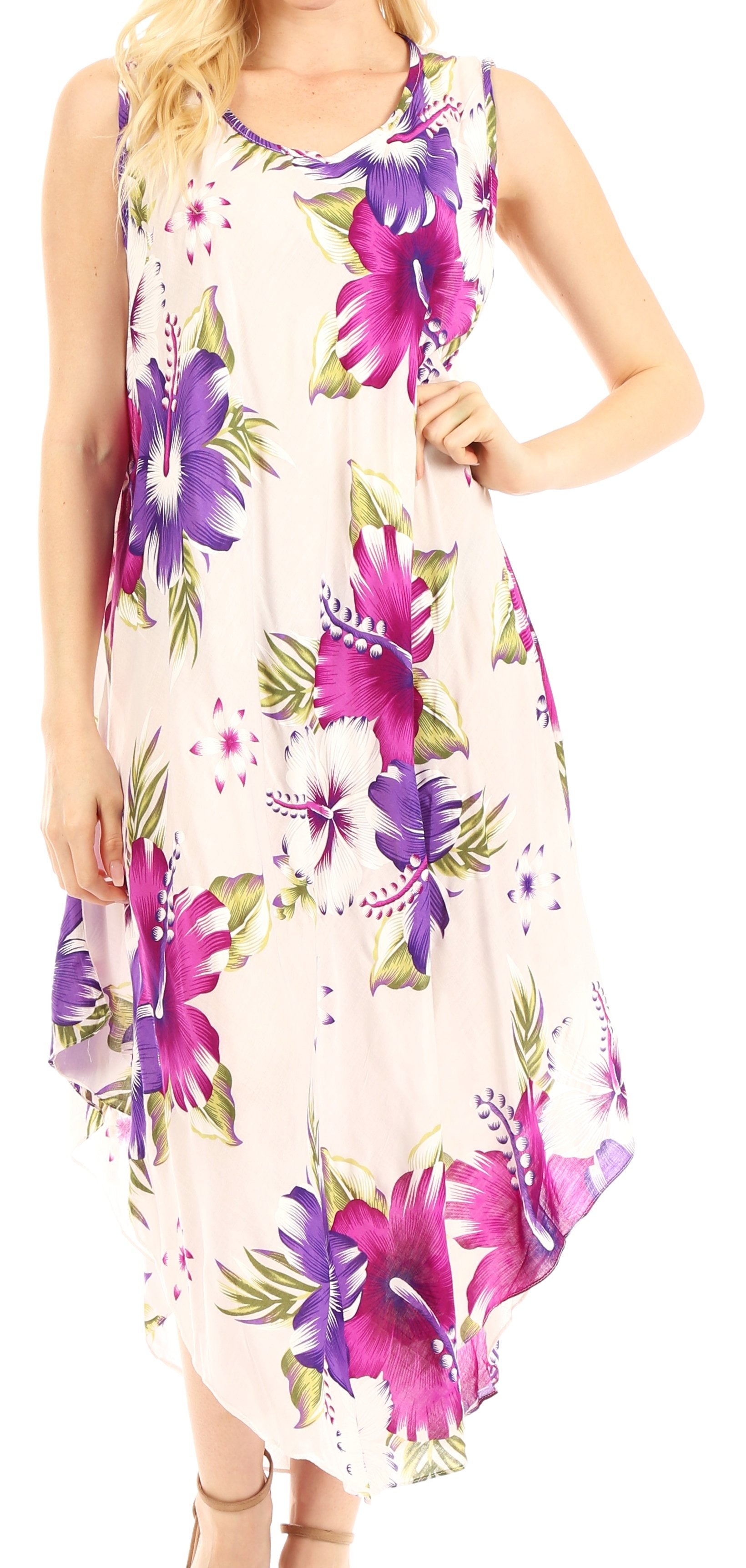 Woman wearing a sleeveless floral dress with purple and pink flowers on a white background
