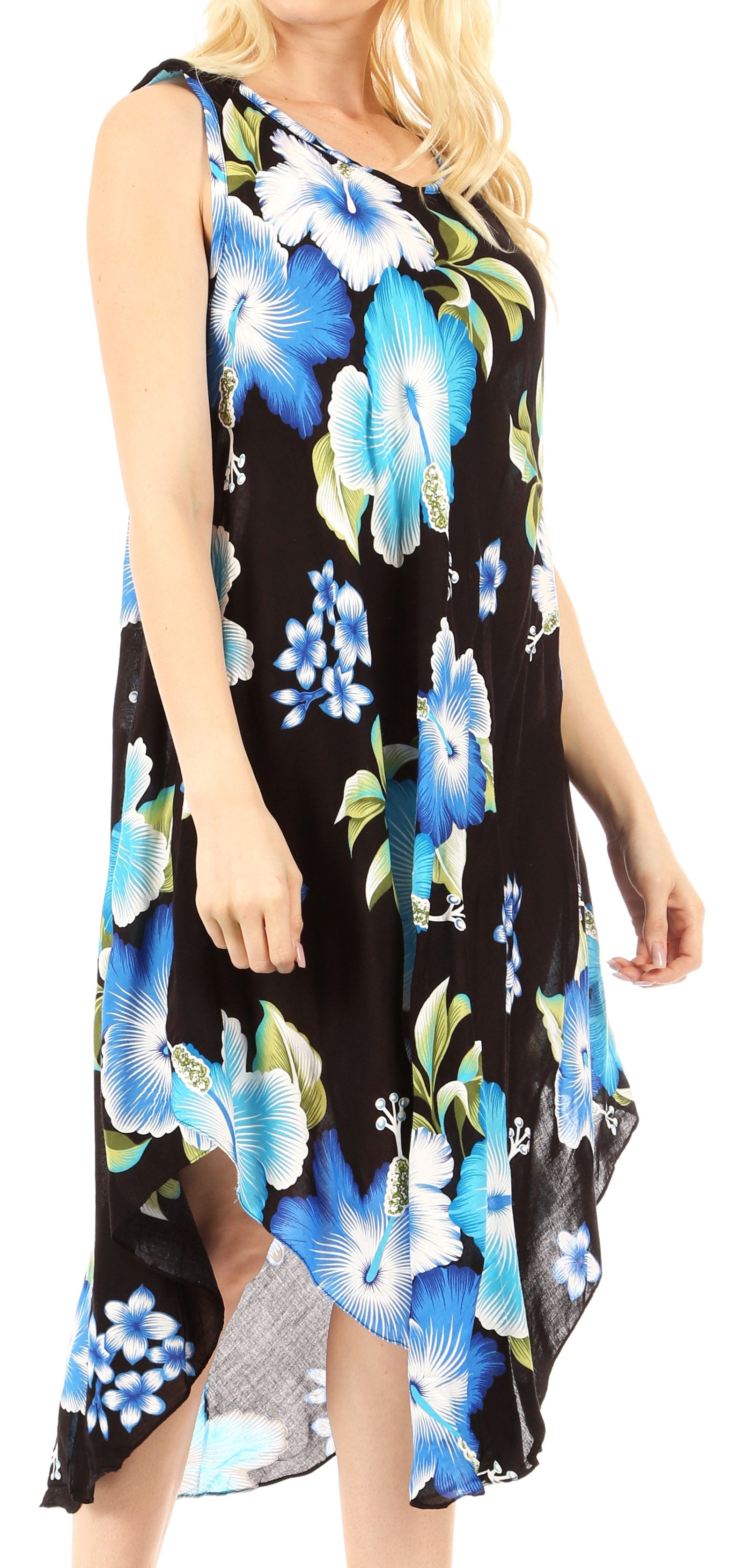 Woman wearing a black floral dress with blue and green flowers.