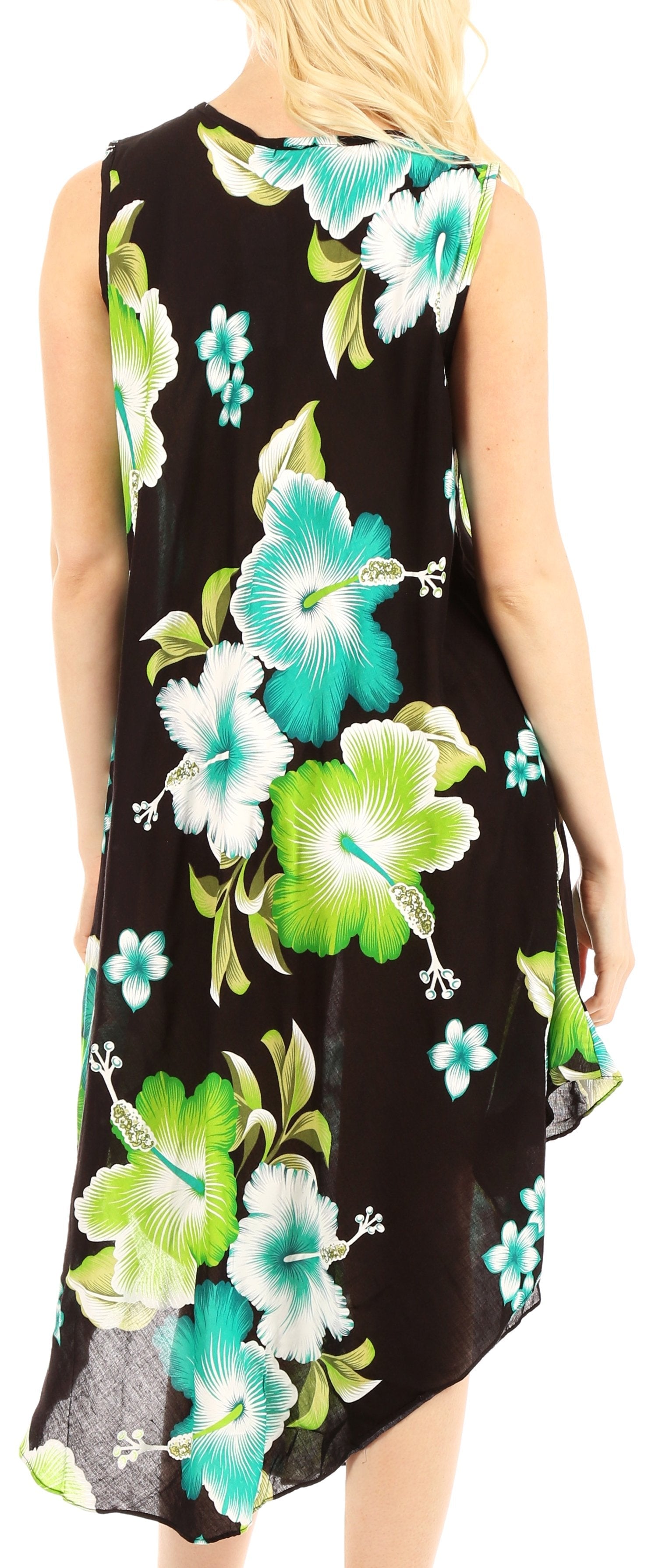 Woman wearing a sleeveless dress with floral pattern on a plain background