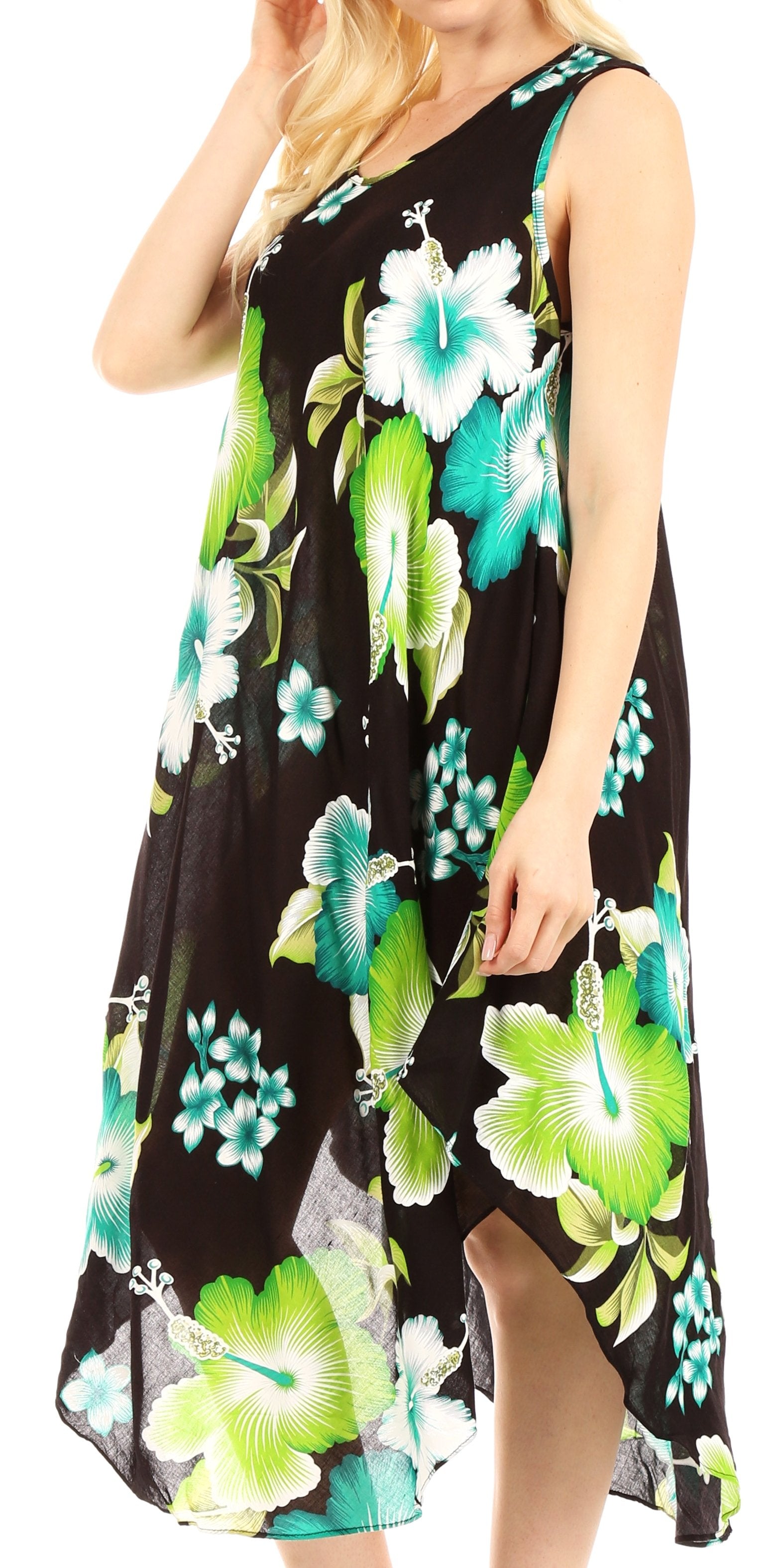 Woman wearing a black sleeveless dress with green floral pattern