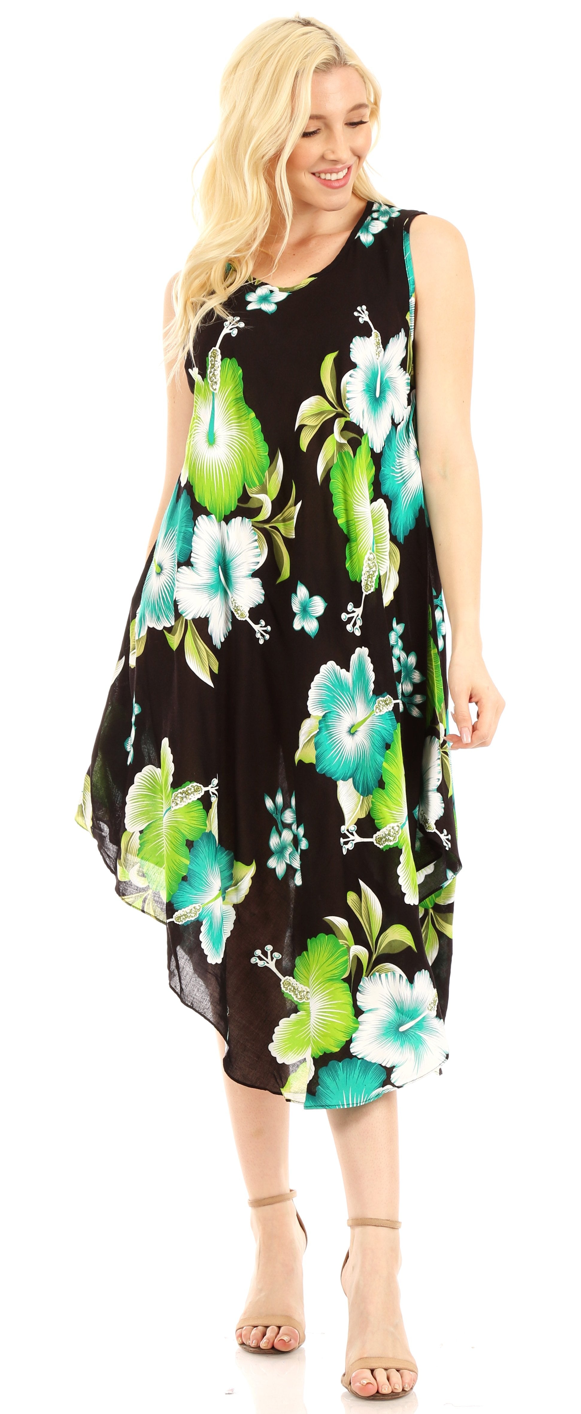 Woman wearing a black floral dress with green and blue flowers on a white background