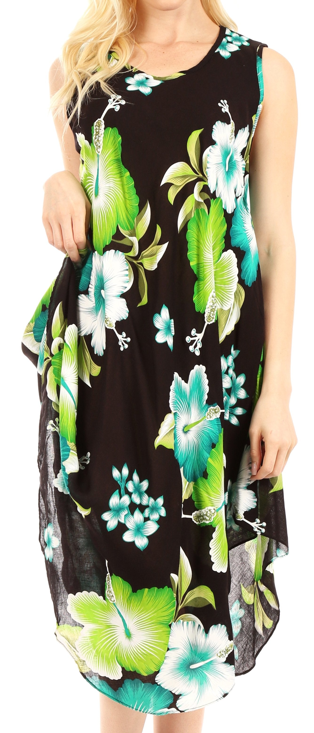 Black dress with green and blue floral pattern worn by a person