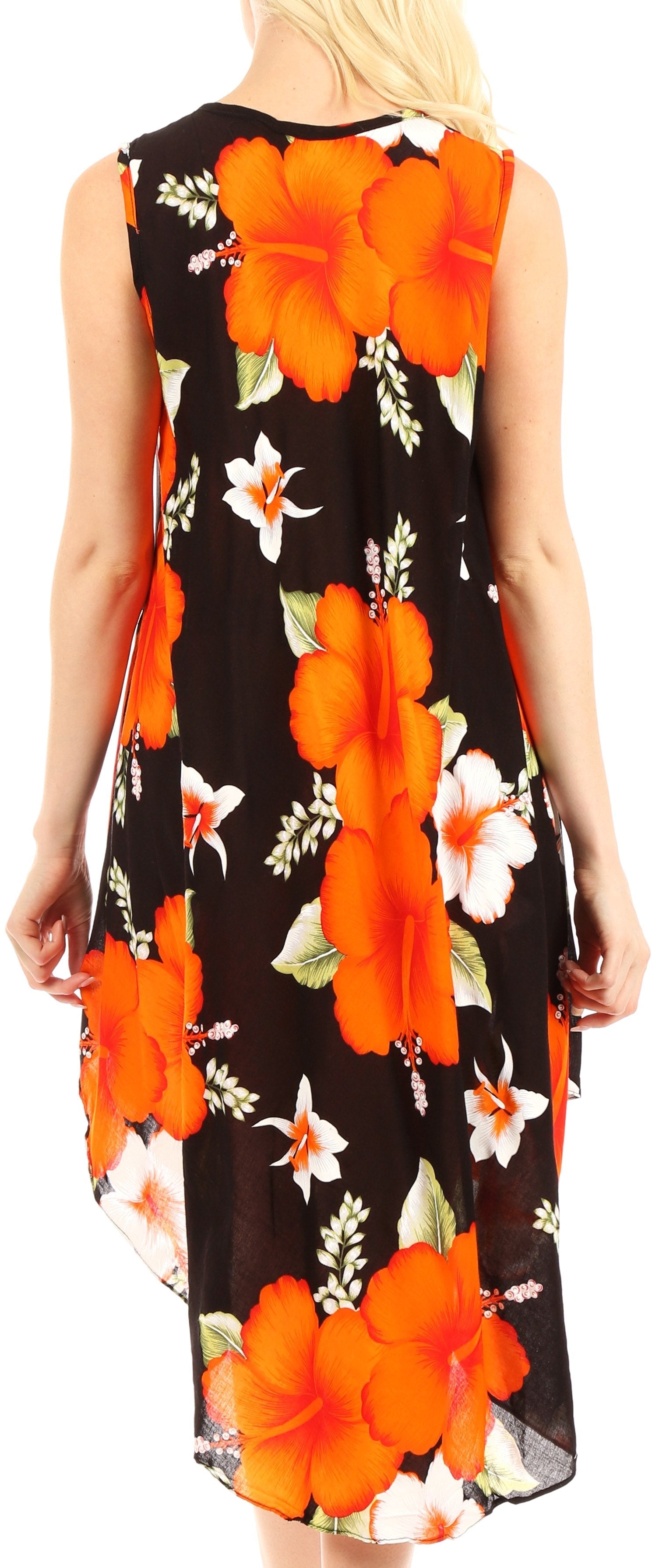 Woman wearing a sleeveless dress with orange floral pattern on a black background