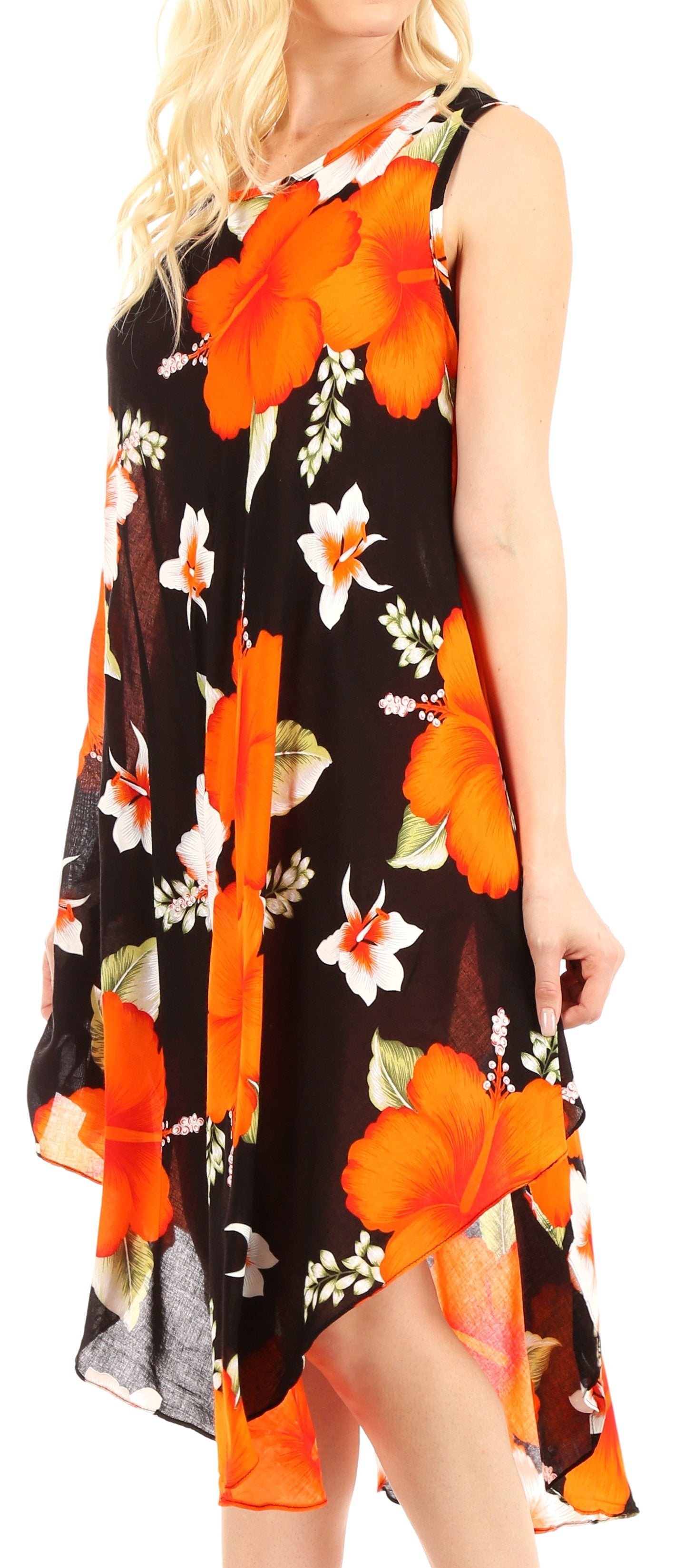 Woman wearing a sleeveless dress with orange and black floral pattern on a white background