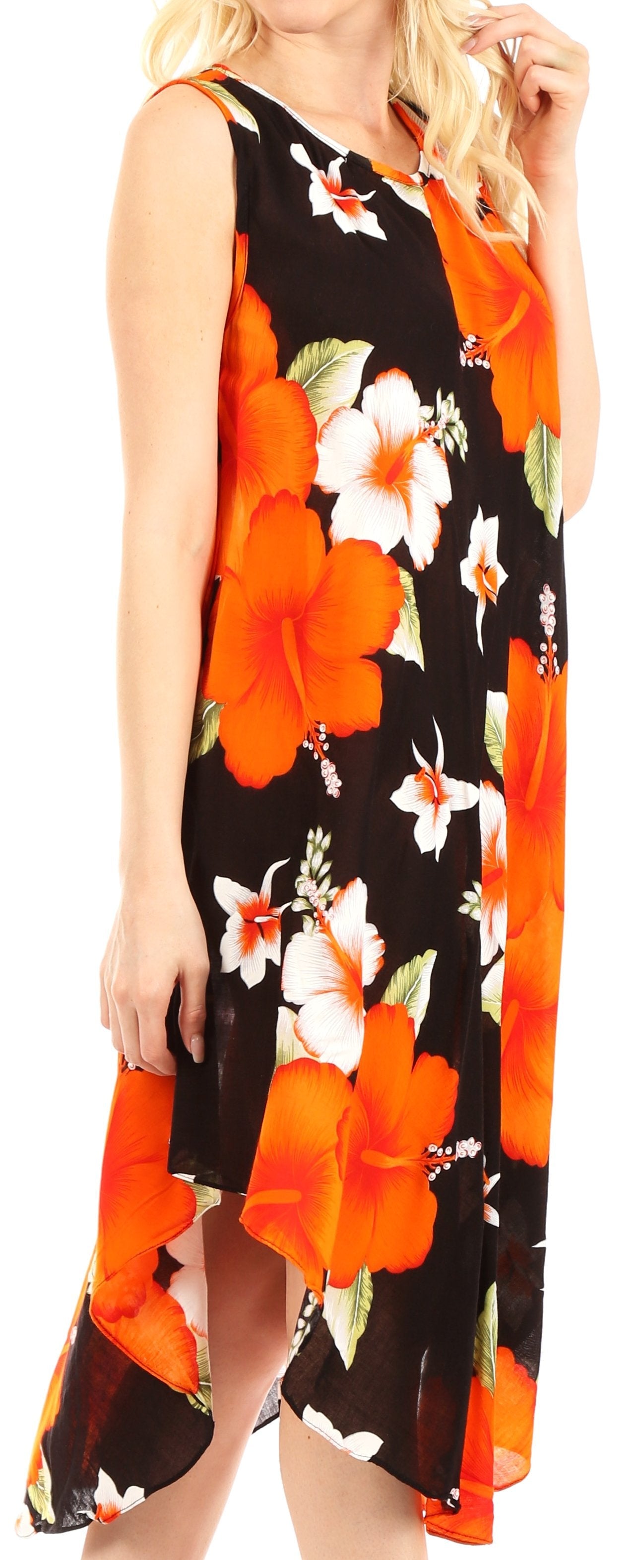 Woman wearing a sleeveless dress with orange floral pattern on a black background