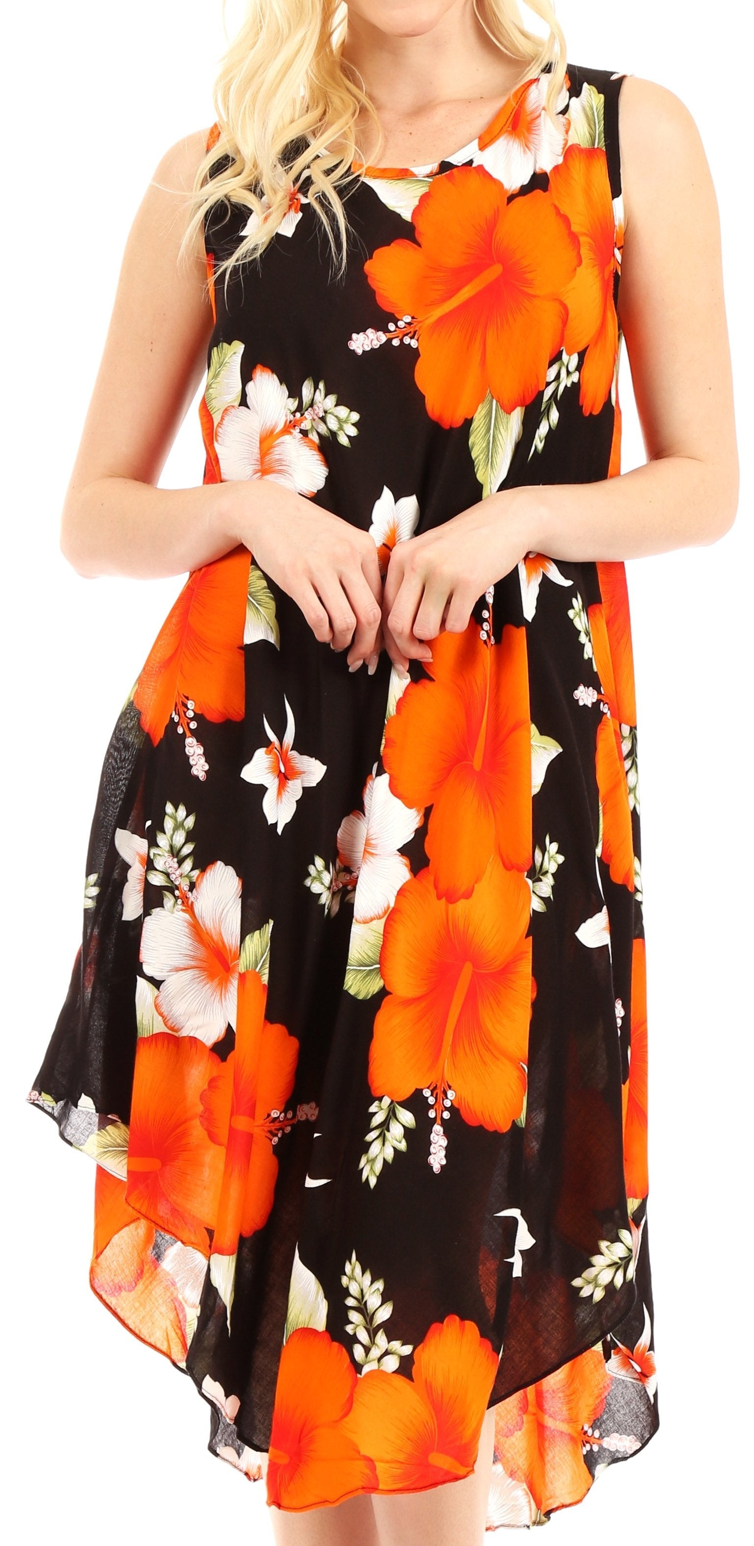 Woman wearing a black dress with orange floral patterns on a white background