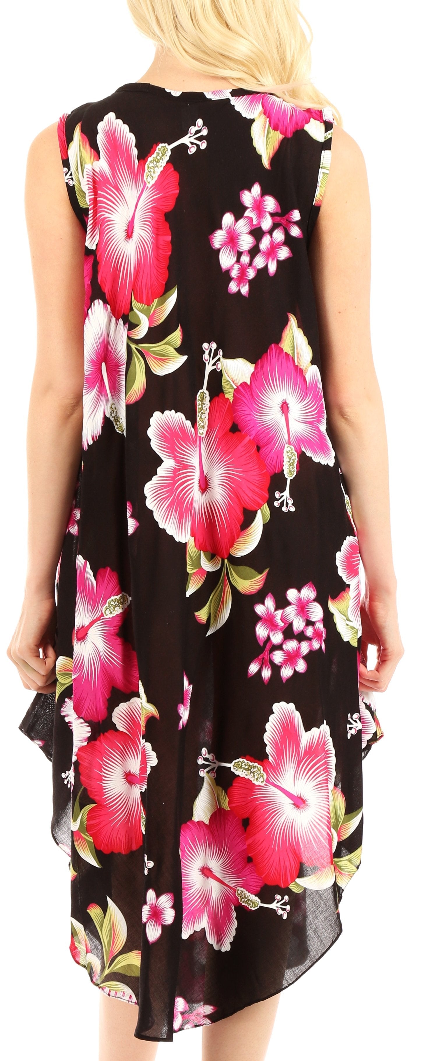 Woman wearing a sleeveless dress with pink floral pattern on black background