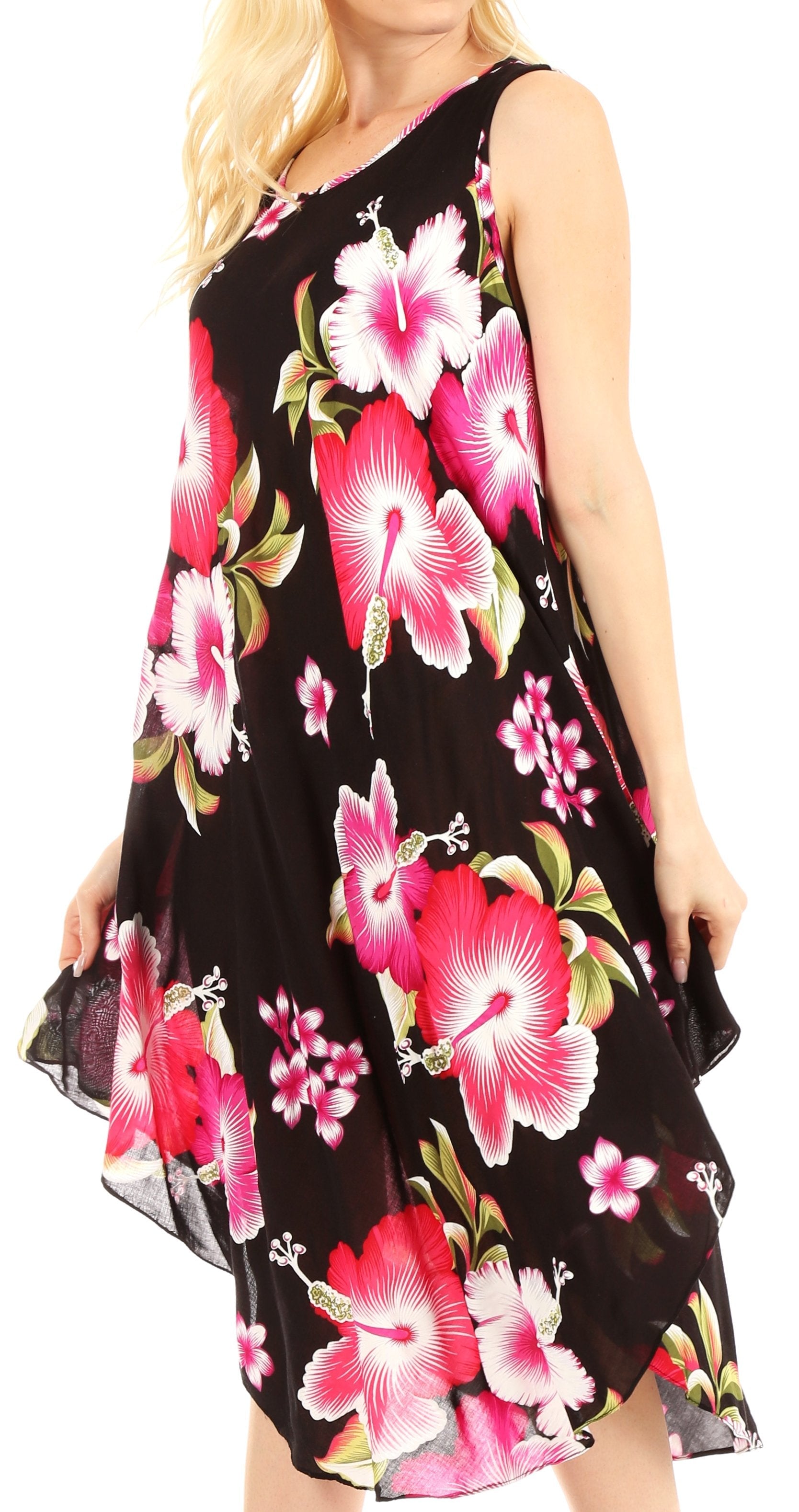 Woman wearing a black sleeveless dress with pink floral pattern on a white background