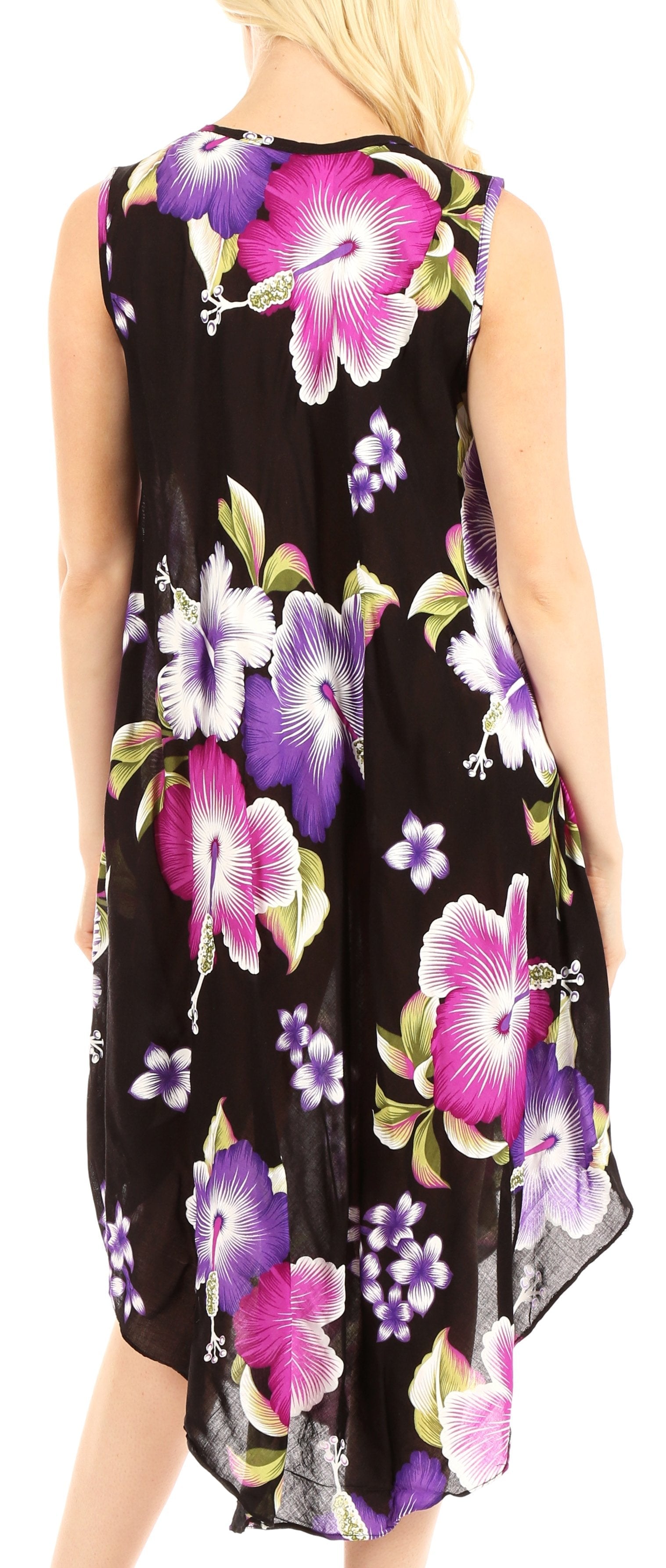 Woman wearing a sleeveless dress with floral pattern on a black background