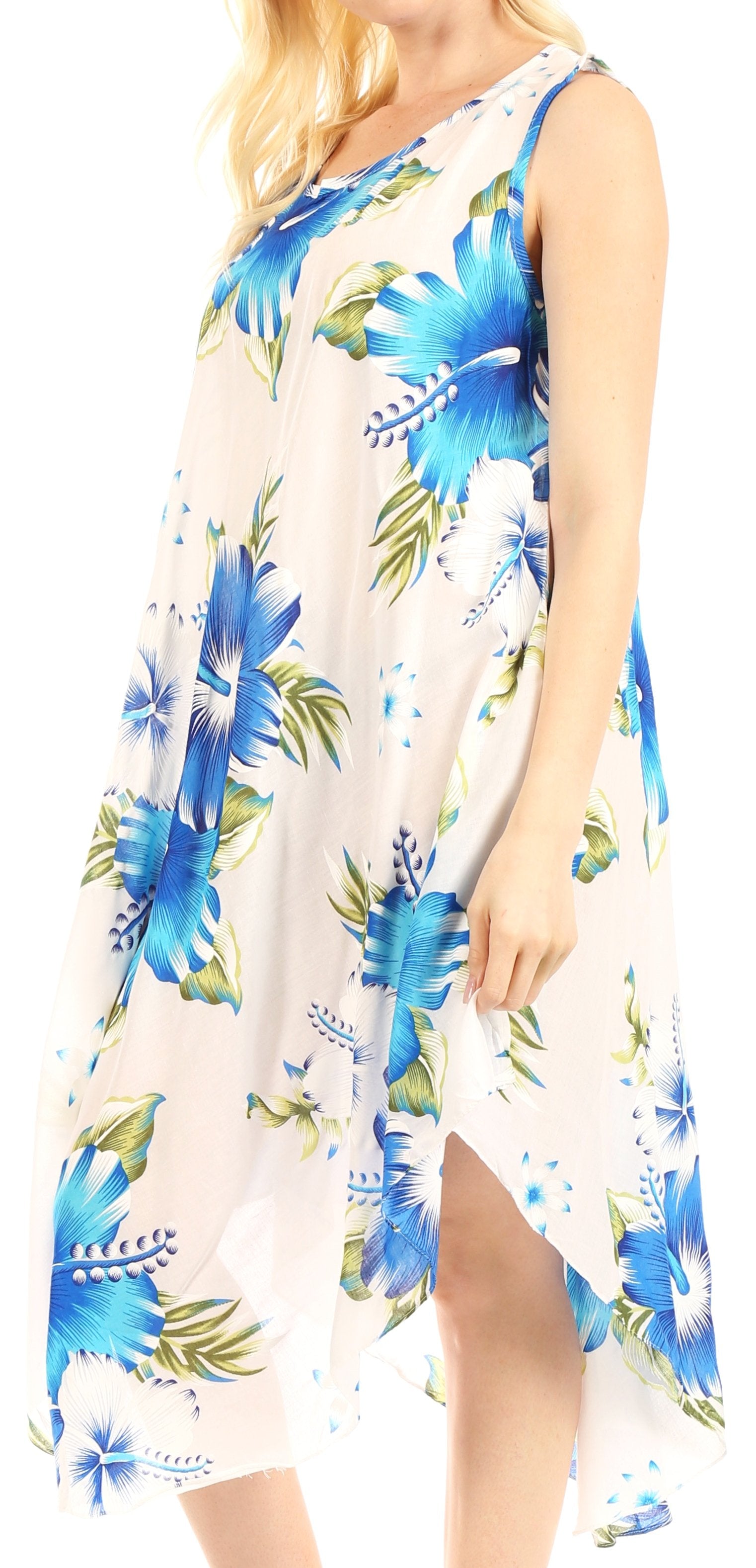 Woman wearing a sleeveless dress with blue floral pattern on a white background