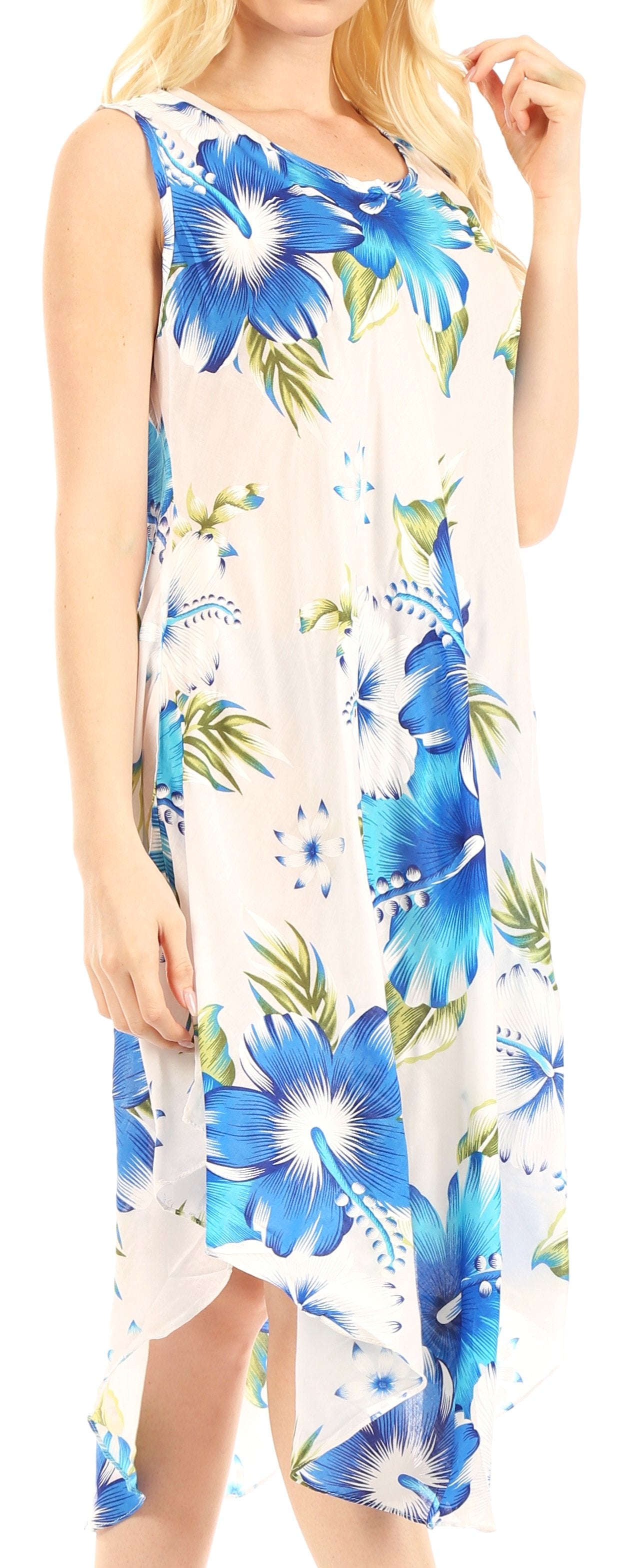 Woman wearing a sleeveless dress with blue floral pattern on a white background