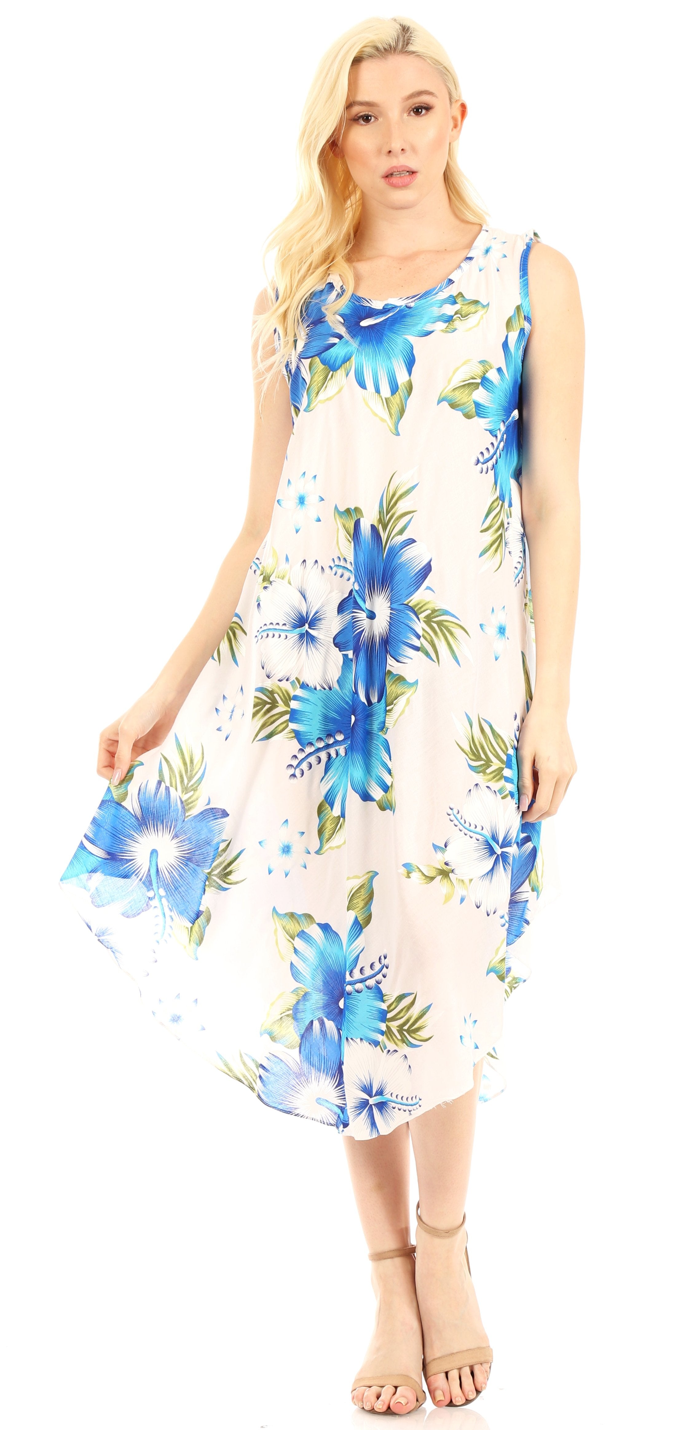 Woman wearing a sleeveless floral dress with blue flowers on a white background