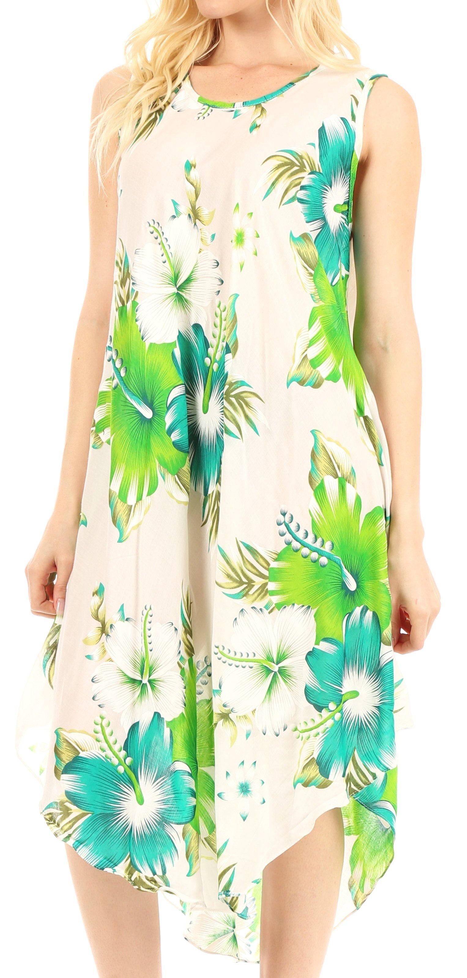 Woman wearing a sleeveless floral dress with green and blue patterns on a white background