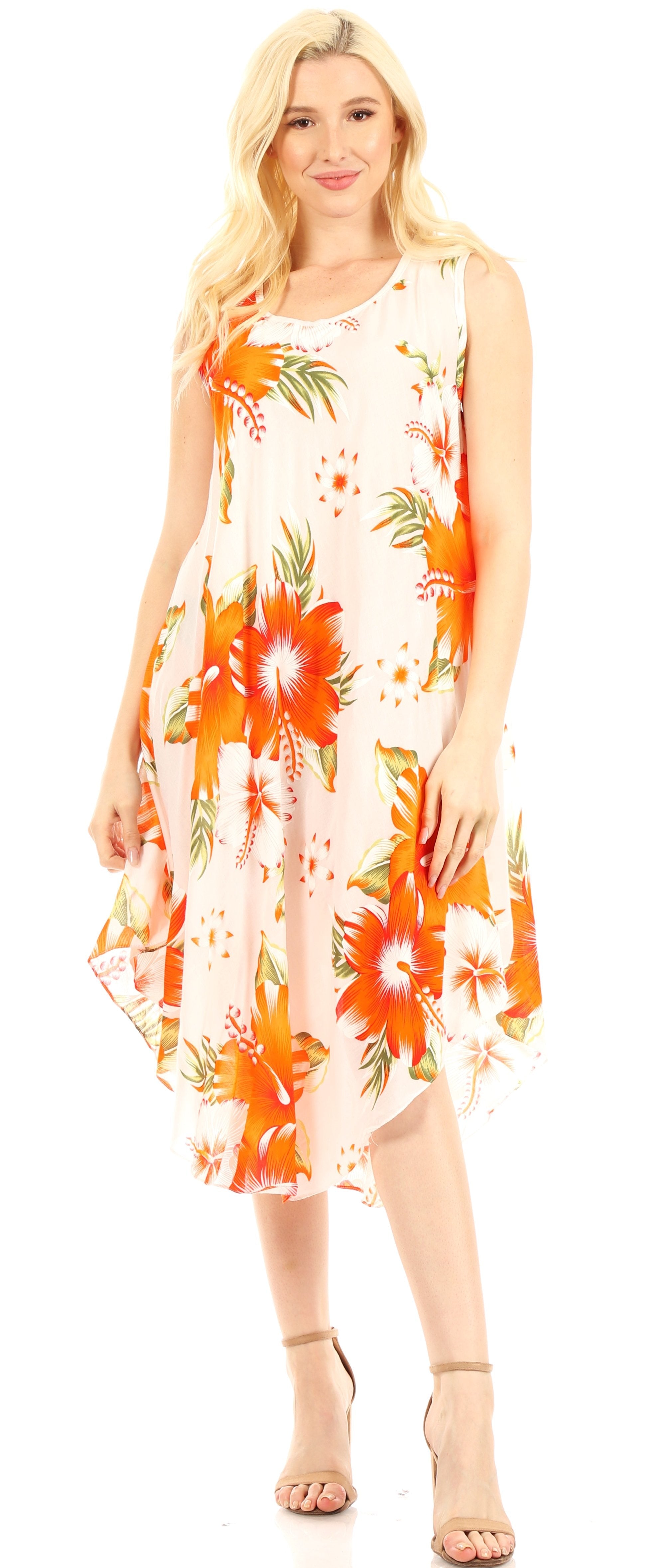 Woman wearing a floral dress with orange and green patterns on a white background