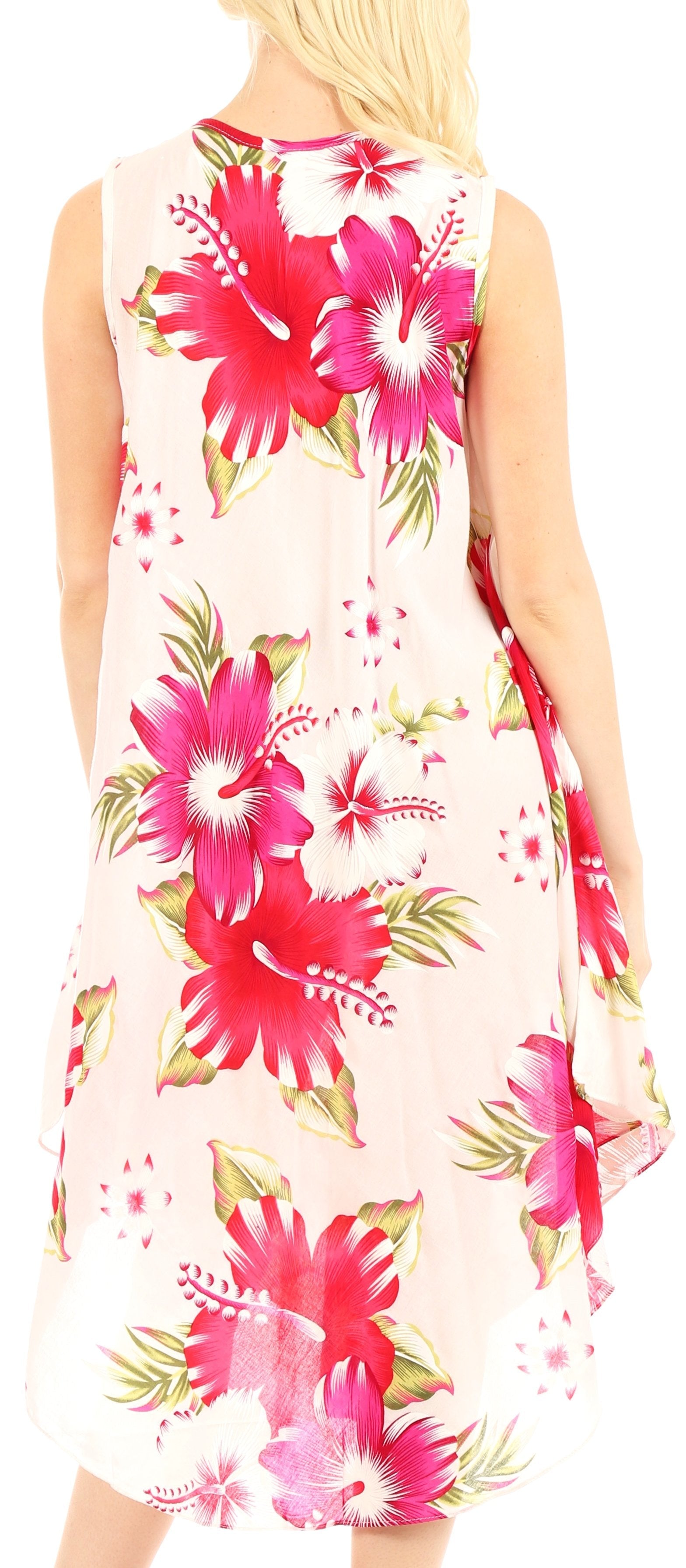 Woman wearing a sleeveless dress with pink floral pattern on a light background