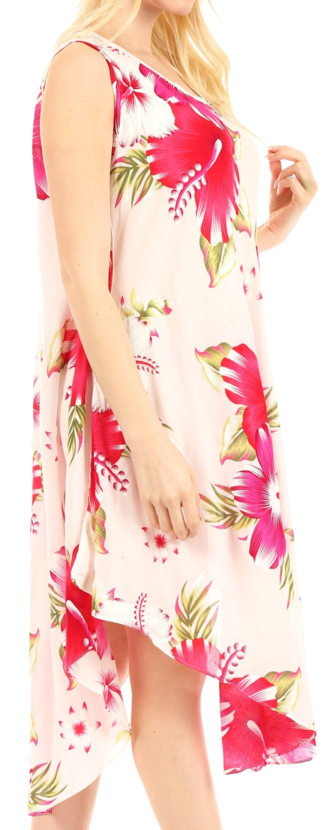 Woman wearing a floral dress with pink and green flowers on a white background