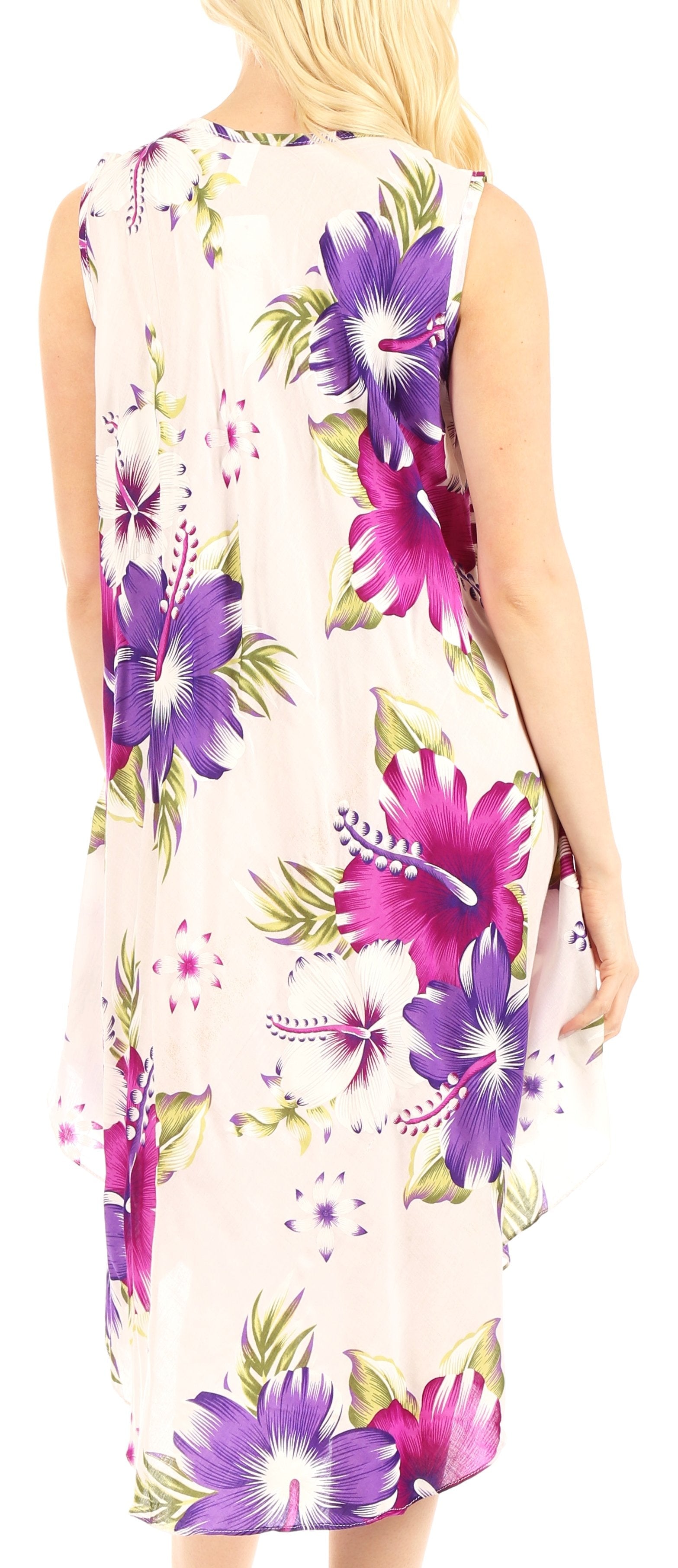 Woman wearing a sleeveless dress with purple floral pattern on a light background