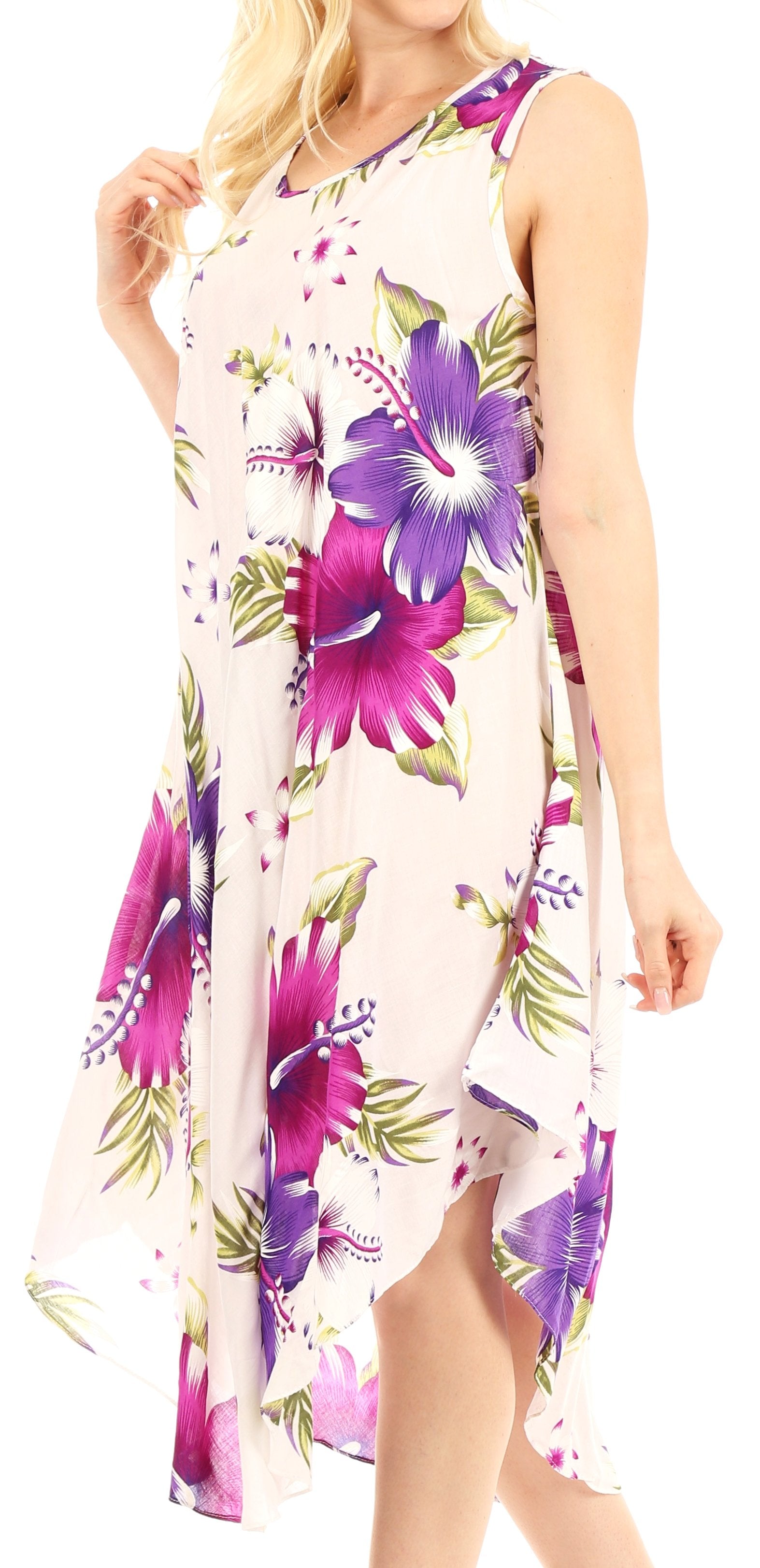 Woman wearing a floral dress with purple and green flowers on a white background