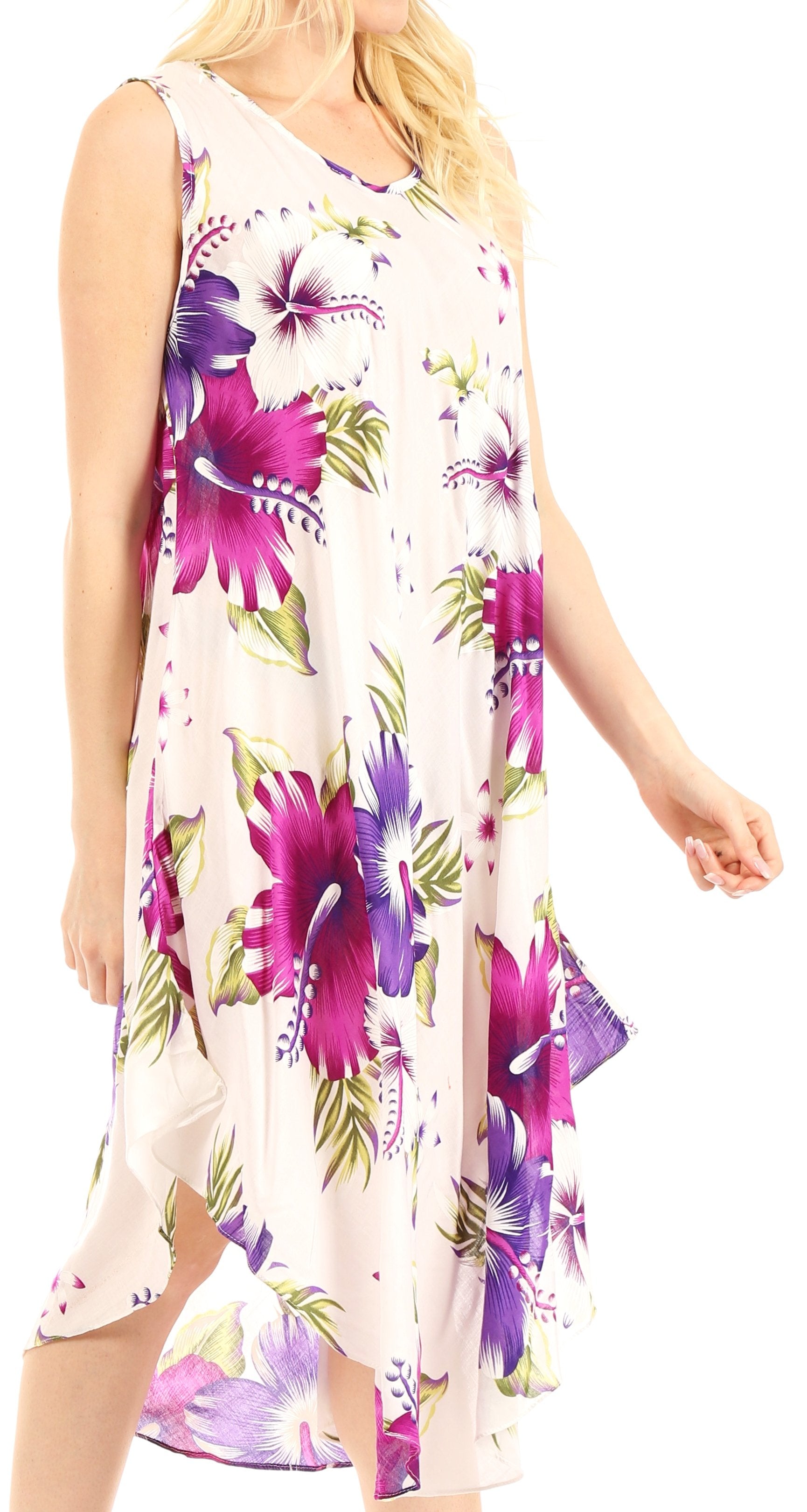 Woman wearing a sleeveless dress with purple floral pattern on a white background