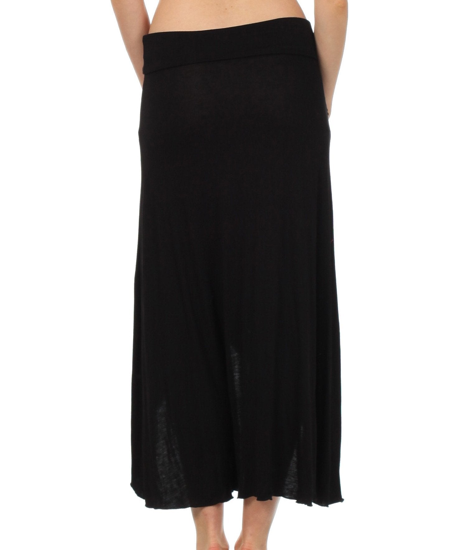 Black skirt worn by a person on a white background