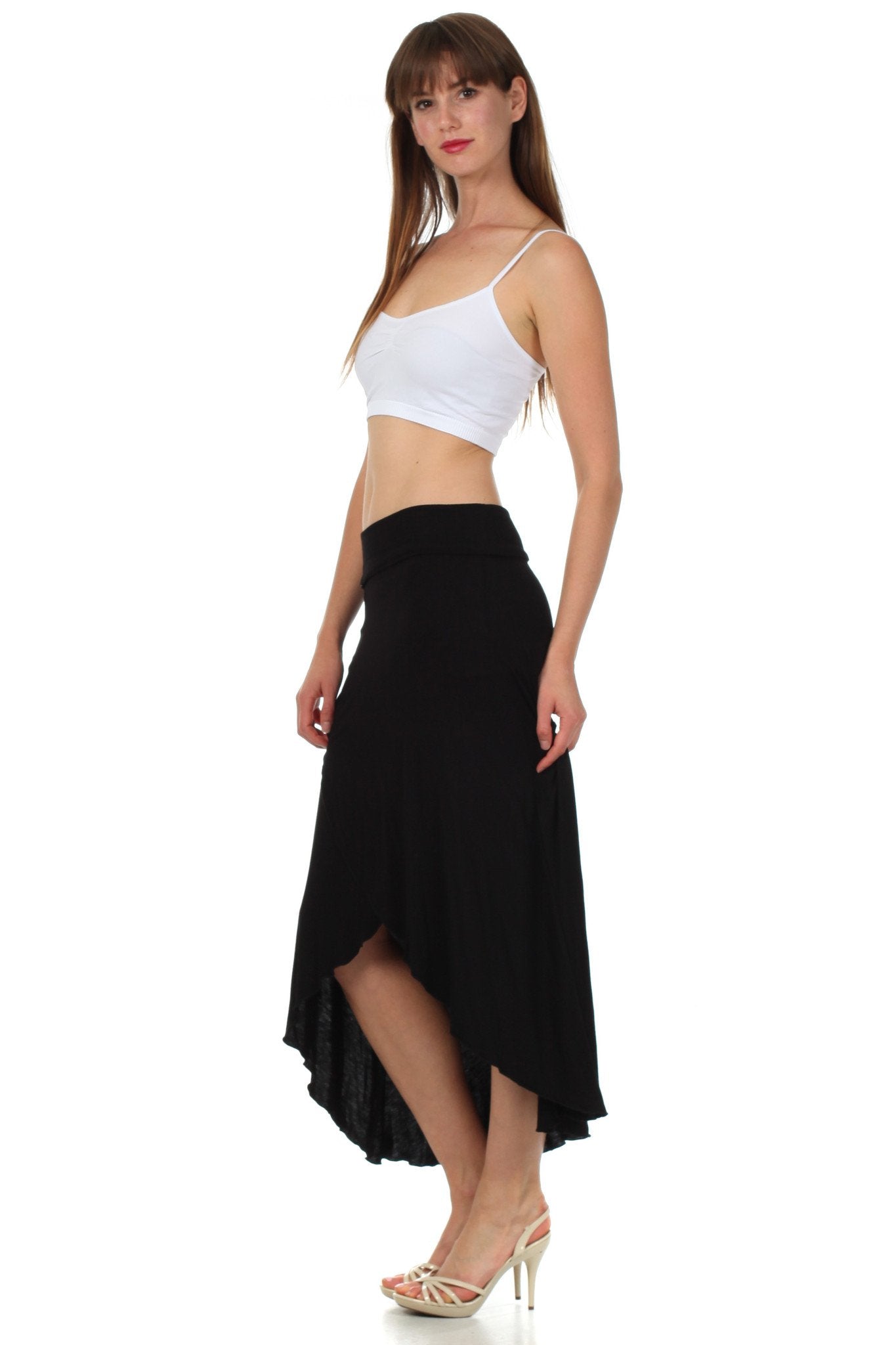 Woman wearing a white top and black skirt on a white background