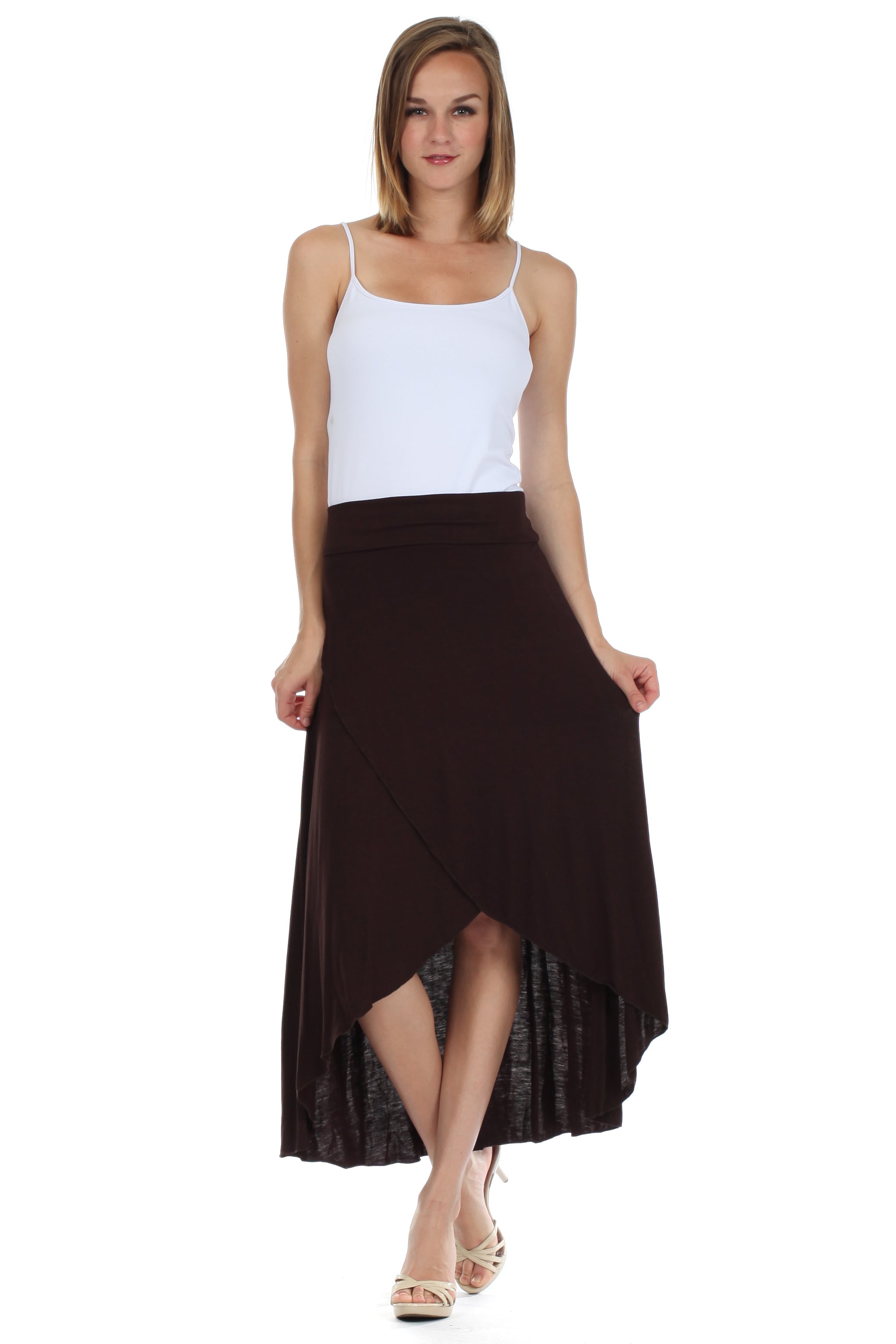 Woman wearing a white top and brown skirt on a white background