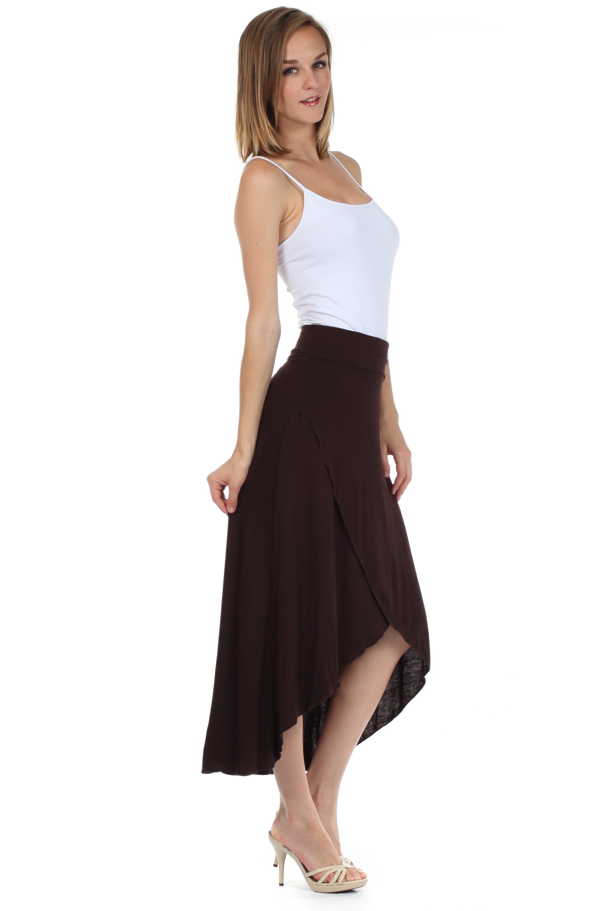 Woman wearing a white top and brown skirt on a white background