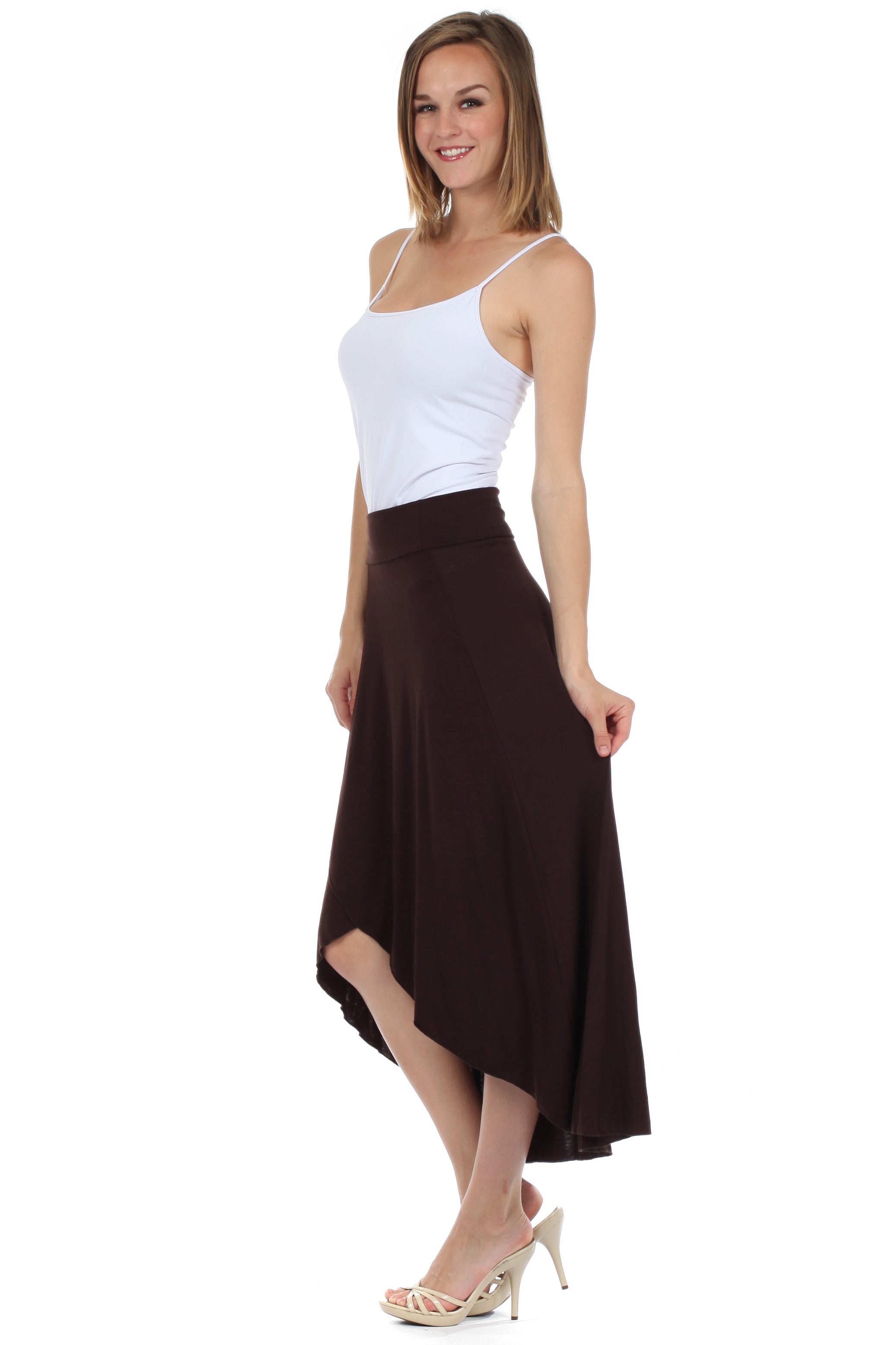 Woman wearing a white top and brown skirt on a white background
