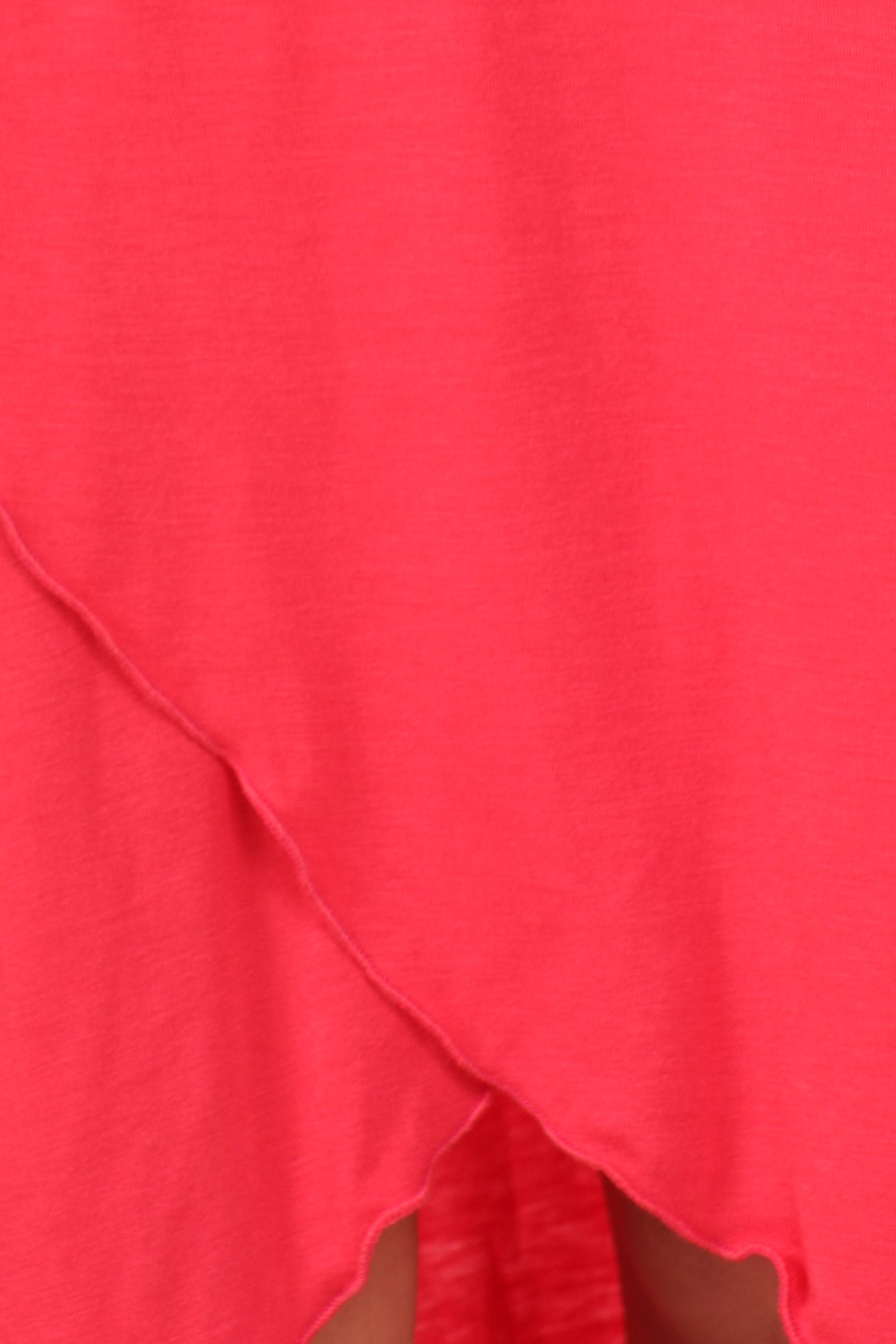 Close-up of a bright pink fabric with a textured surface.
