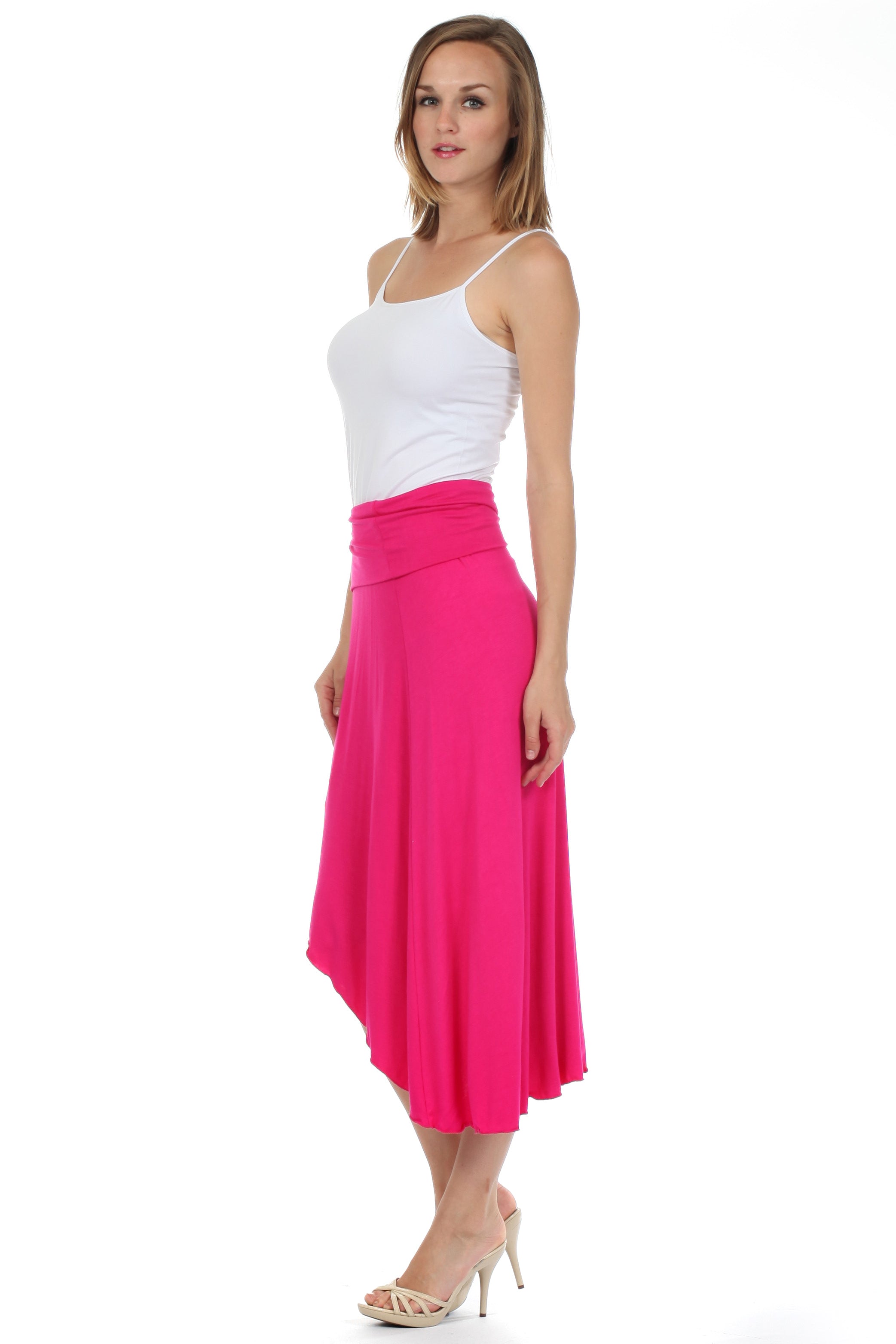 Woman wearing a white top and pink skirt on a white background