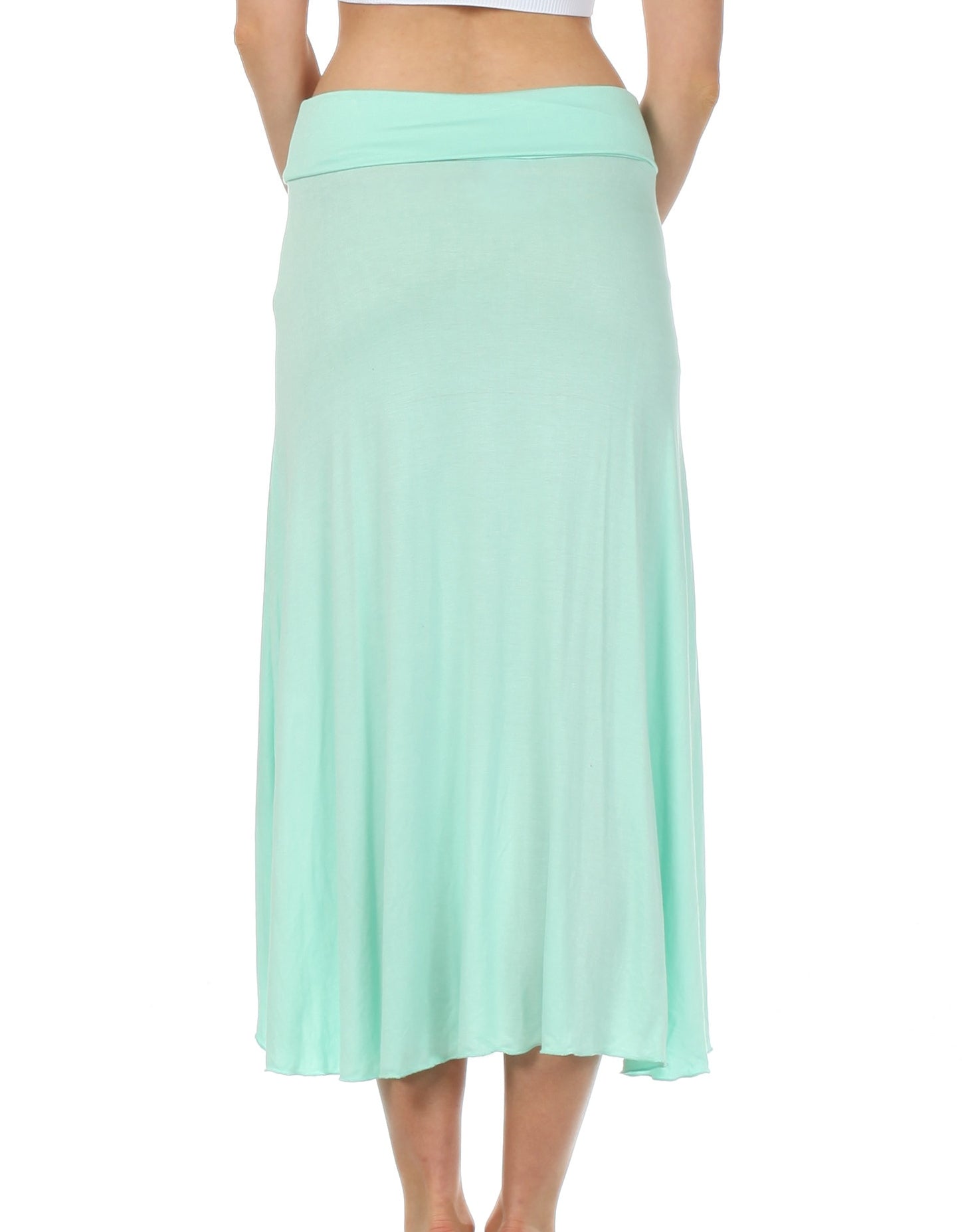Mint green skirt worn by a person on a white background