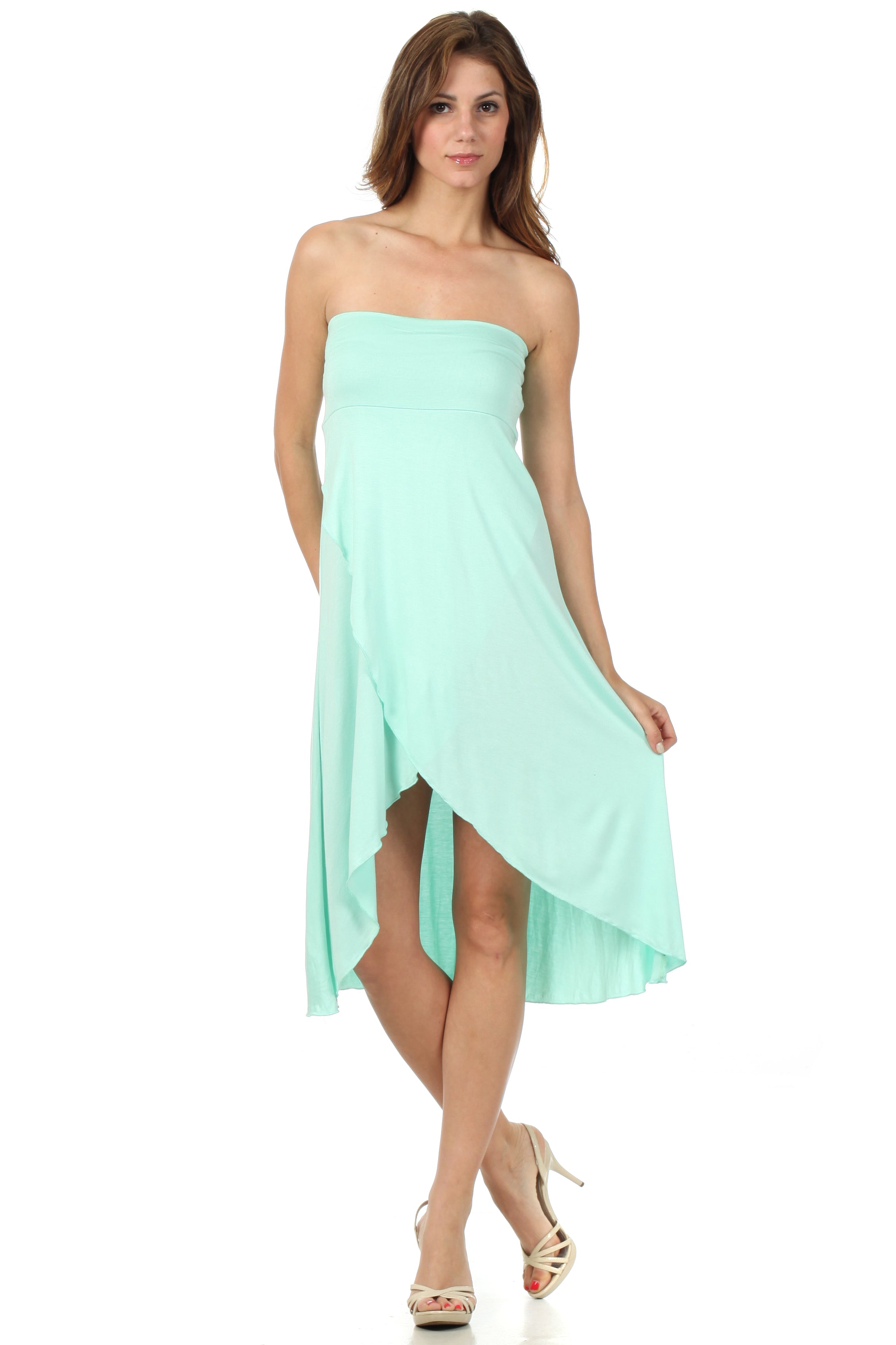Woman wearing a light blue strapless dress on a white background