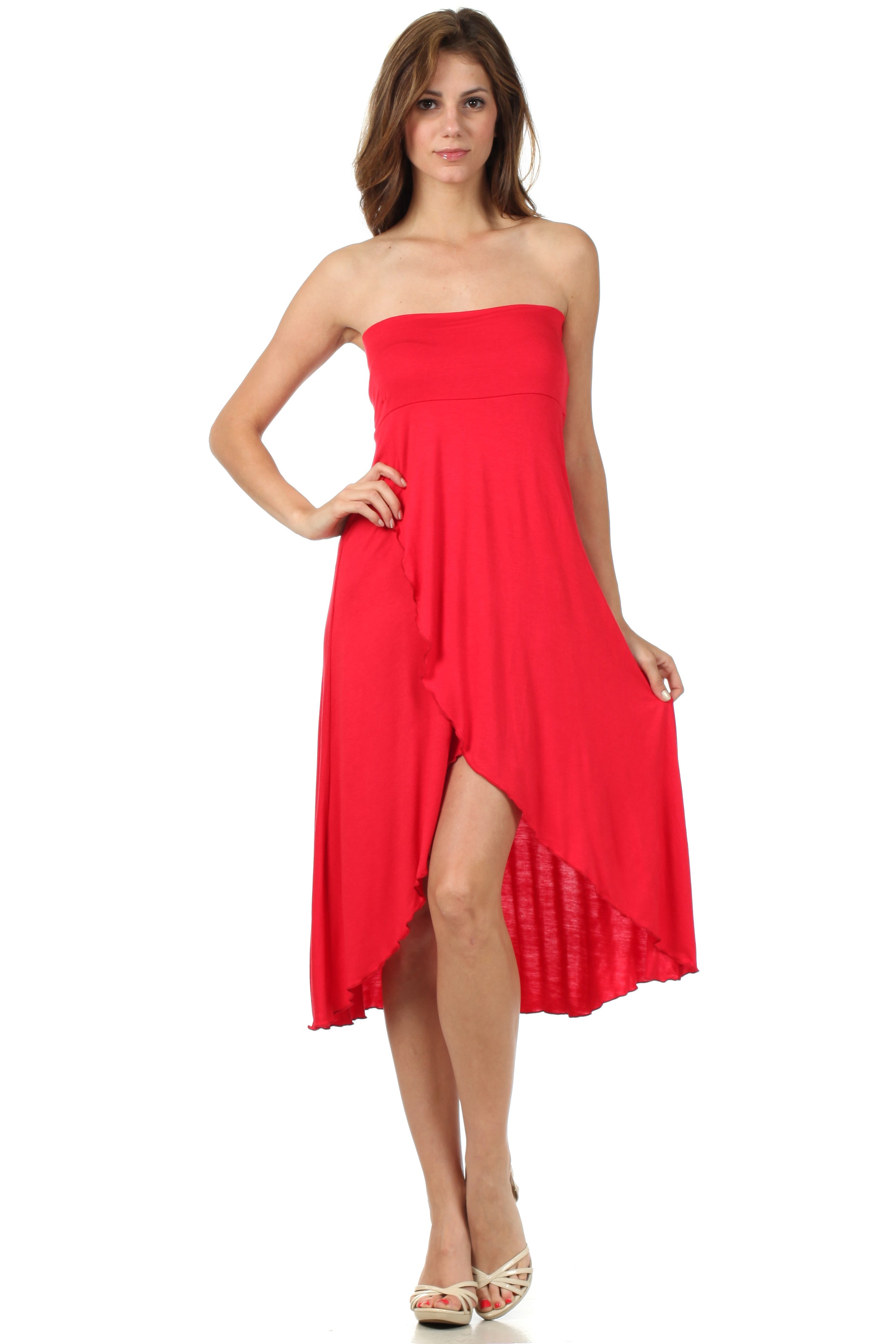 Woman wearing a strapless red dress on a white background