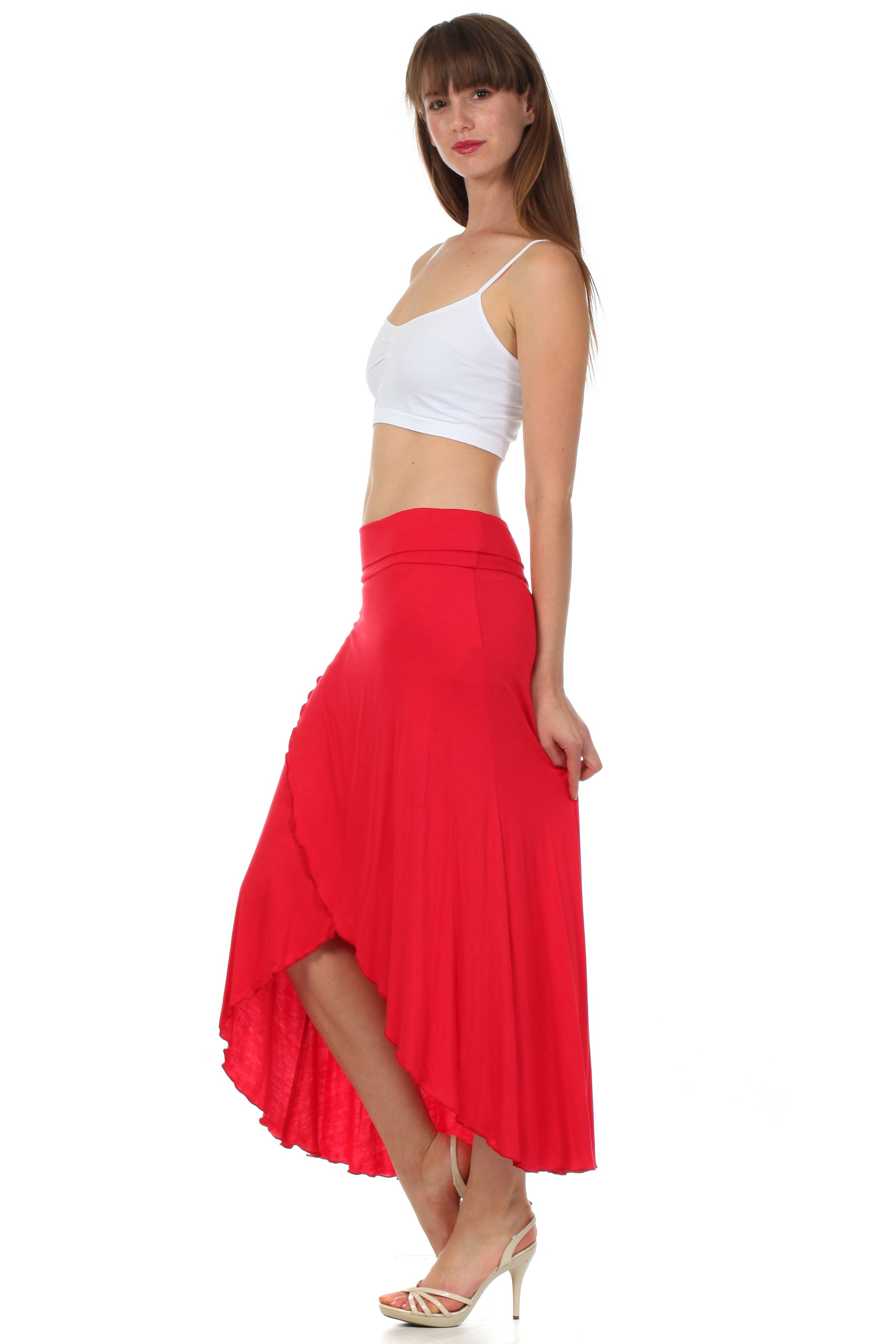 Woman wearing a white top and red skirt on a white background