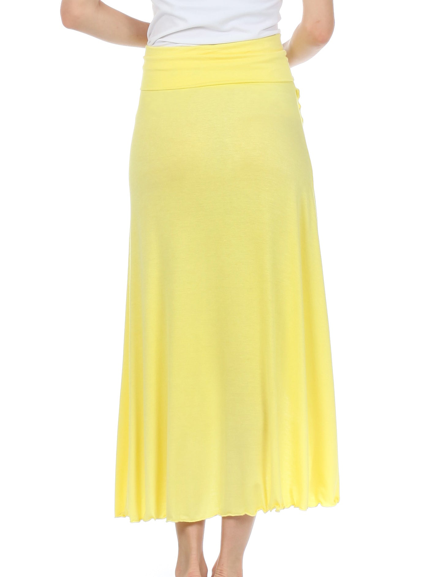 Yellow skirt worn by a person on a white background